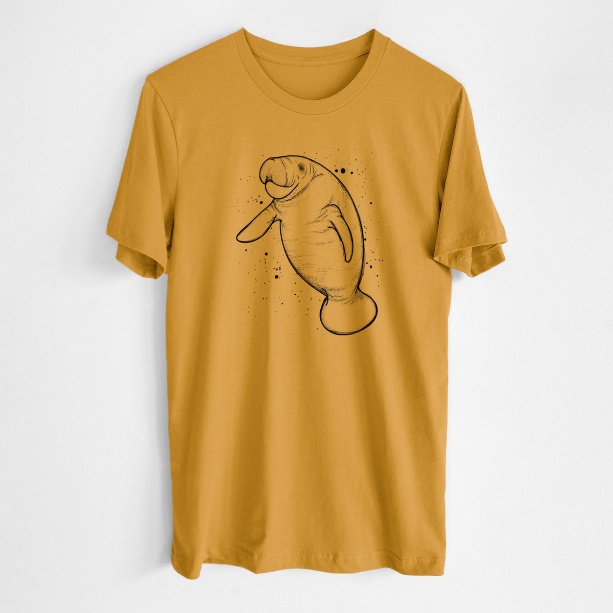Honeycomb yellow lightweight cotton t-shirt laid flat, printed with a black ink line drawing of a manatee swimming, with ink splatters.