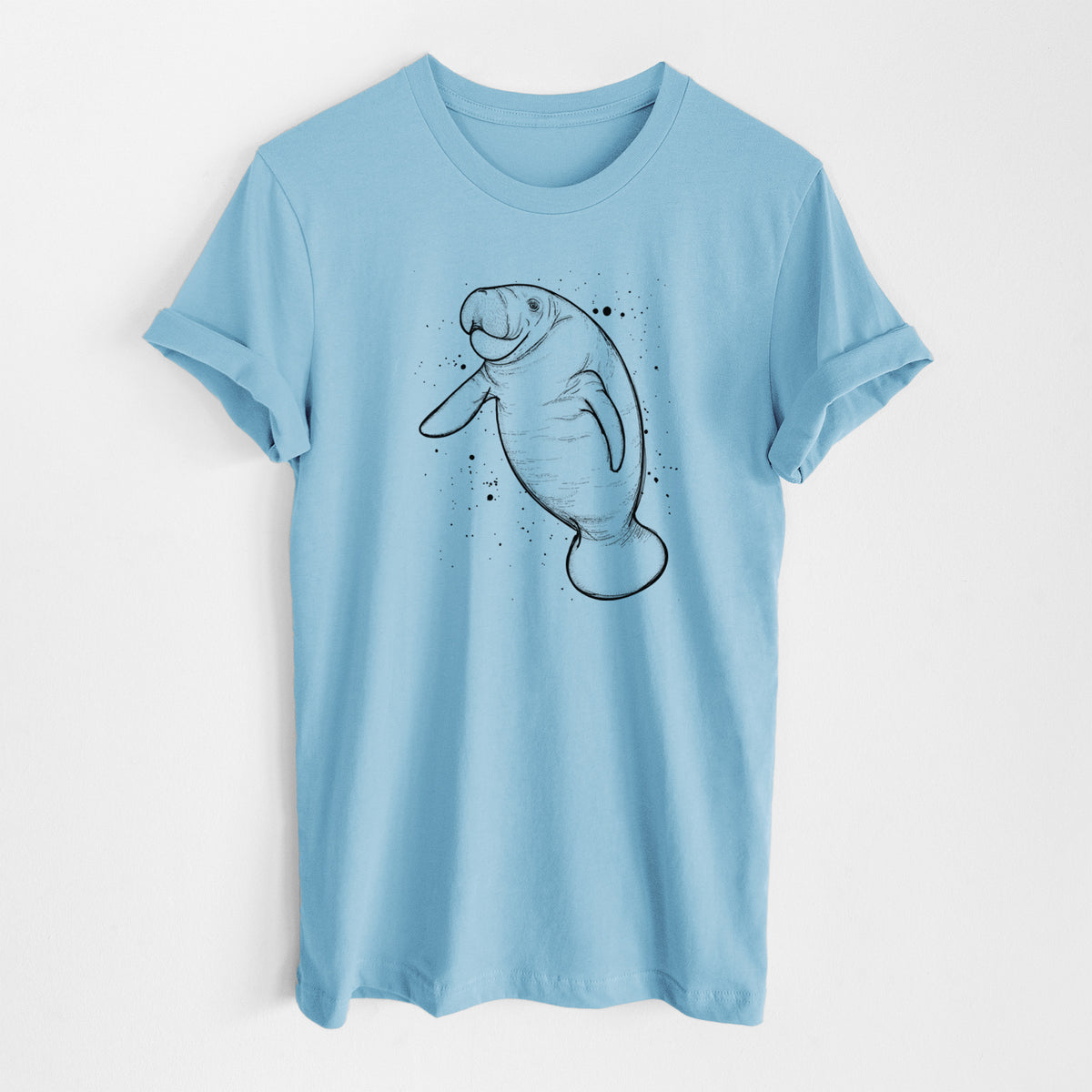 Ocean blue lightweight cotton t-shirt laid flat, printed with a black ink line drawing of a manatee swimming, with ink splatters.