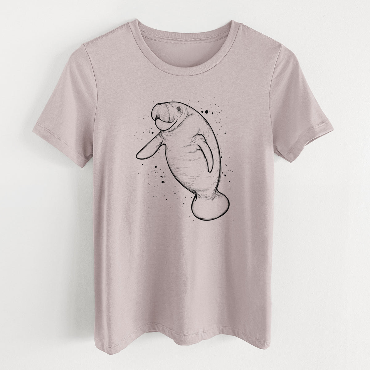 Pink gravel women's relaxed fit cotton t-shirt laid flat, printed with a black ink line drawing of a manatee swimming, with ink splatters.