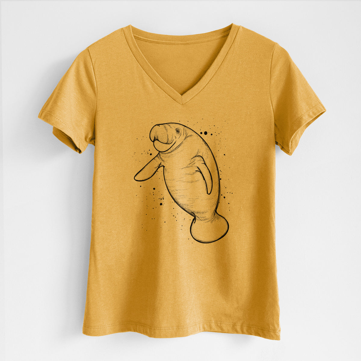 Honeycomb yellow women's relaxed fit cotton V-neck t-shirt laid flat, printed with a black ink line drawing of a manatee swimming, with ink splatters.