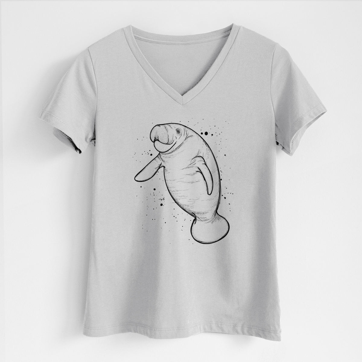 Lunar grey women's relaxed fit cotton V-neck t-shirt laid flat, printed with a black ink line drawing of a manatee swimming, with ink splatters.