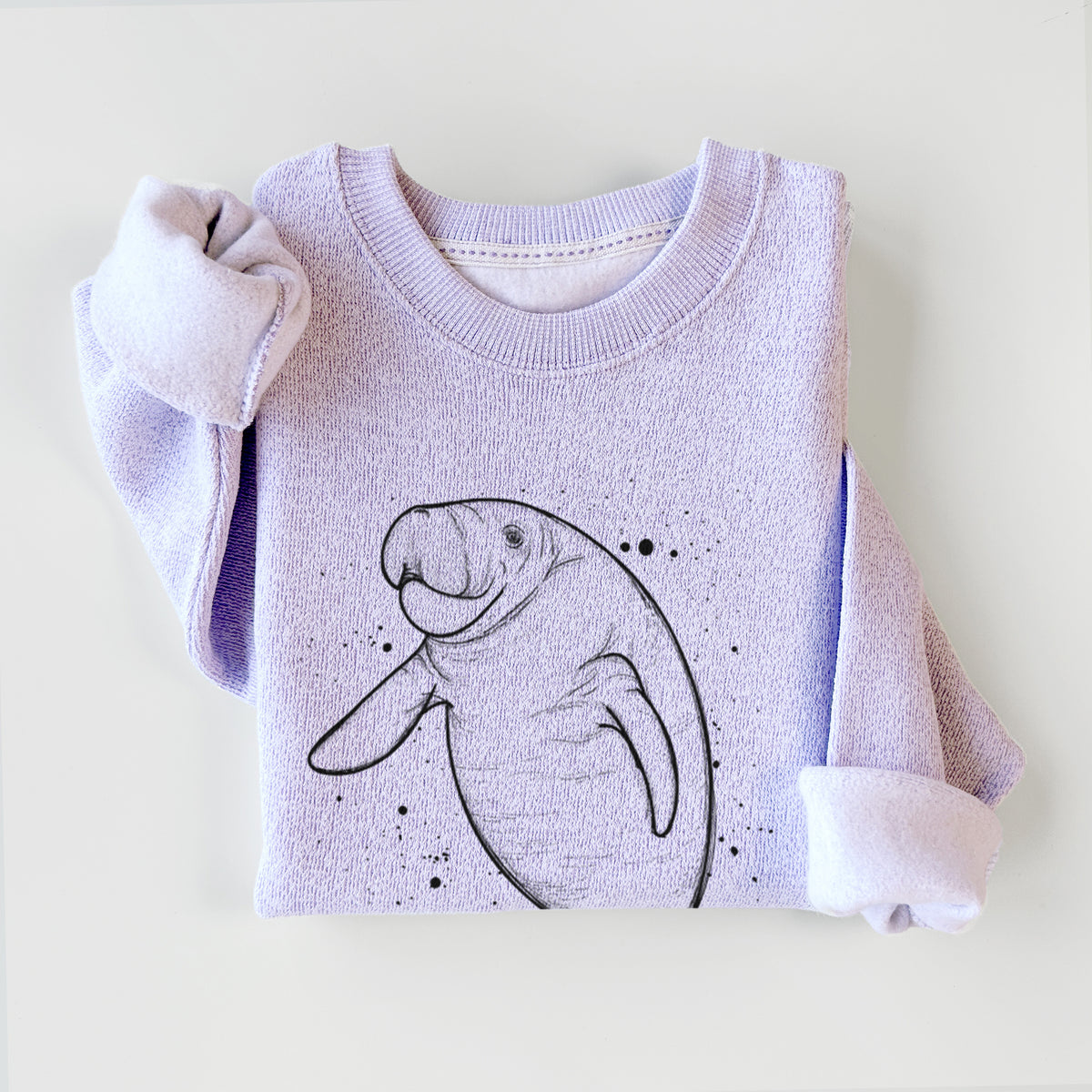 Ice purple knit sweatshirt printed with a black ink line drawing of a manatee swimming, with ink splatters, styled flat.