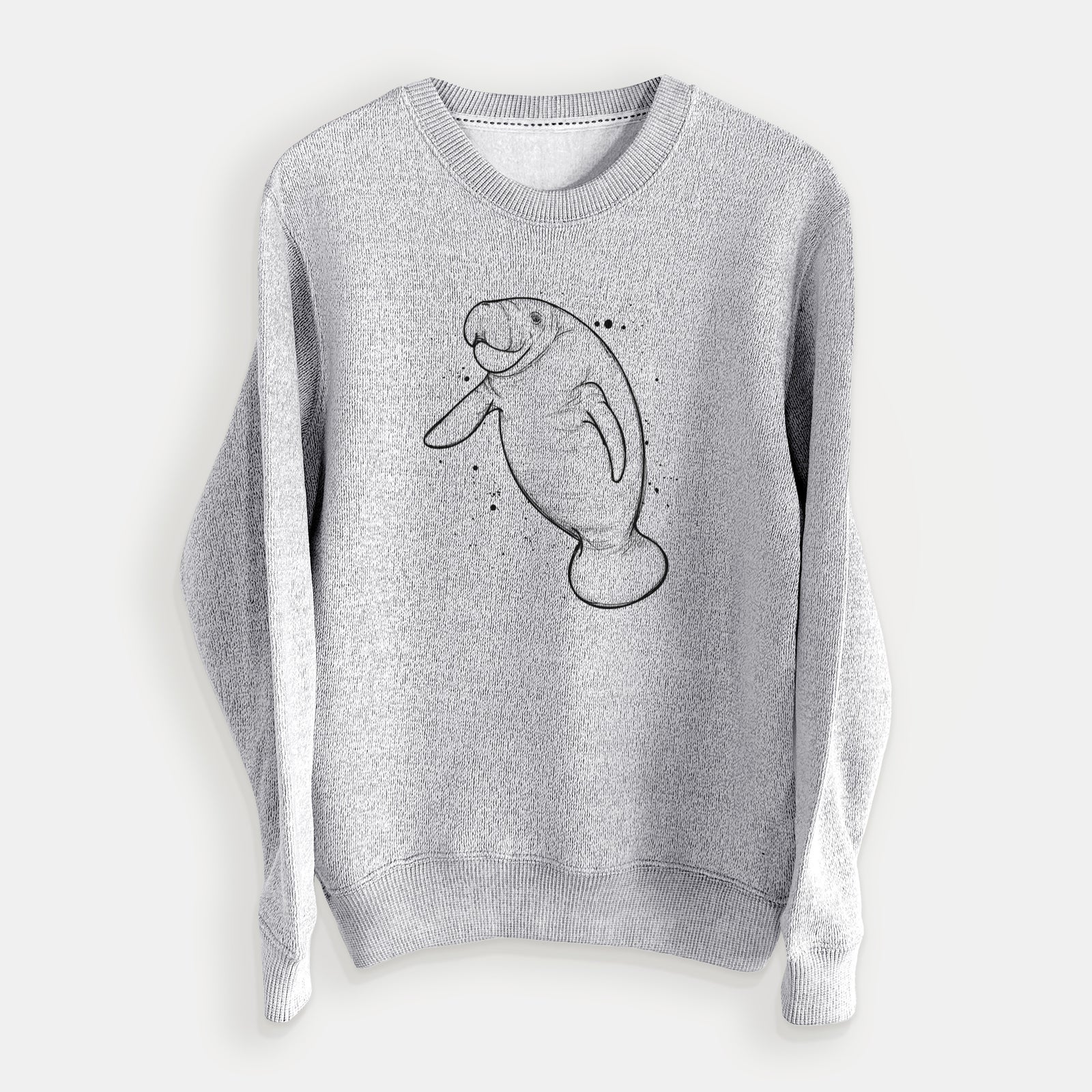 Salt and pepper knit sweatshirt laid flat, printed with a black ink line drawing of a manatee swimming, with ink splatters.