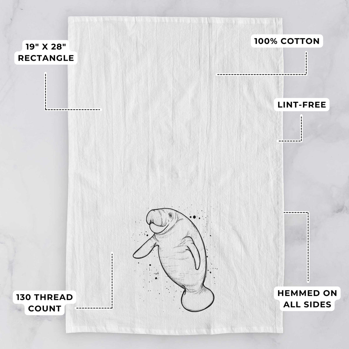 White tea towel printed with a black ink line drawing of a manatee swimming, with ink splatters, with feature labels: 19 by 28 inch rectangle, 100% cotton, lint-free, 130 thread count, hemmed on all sides.