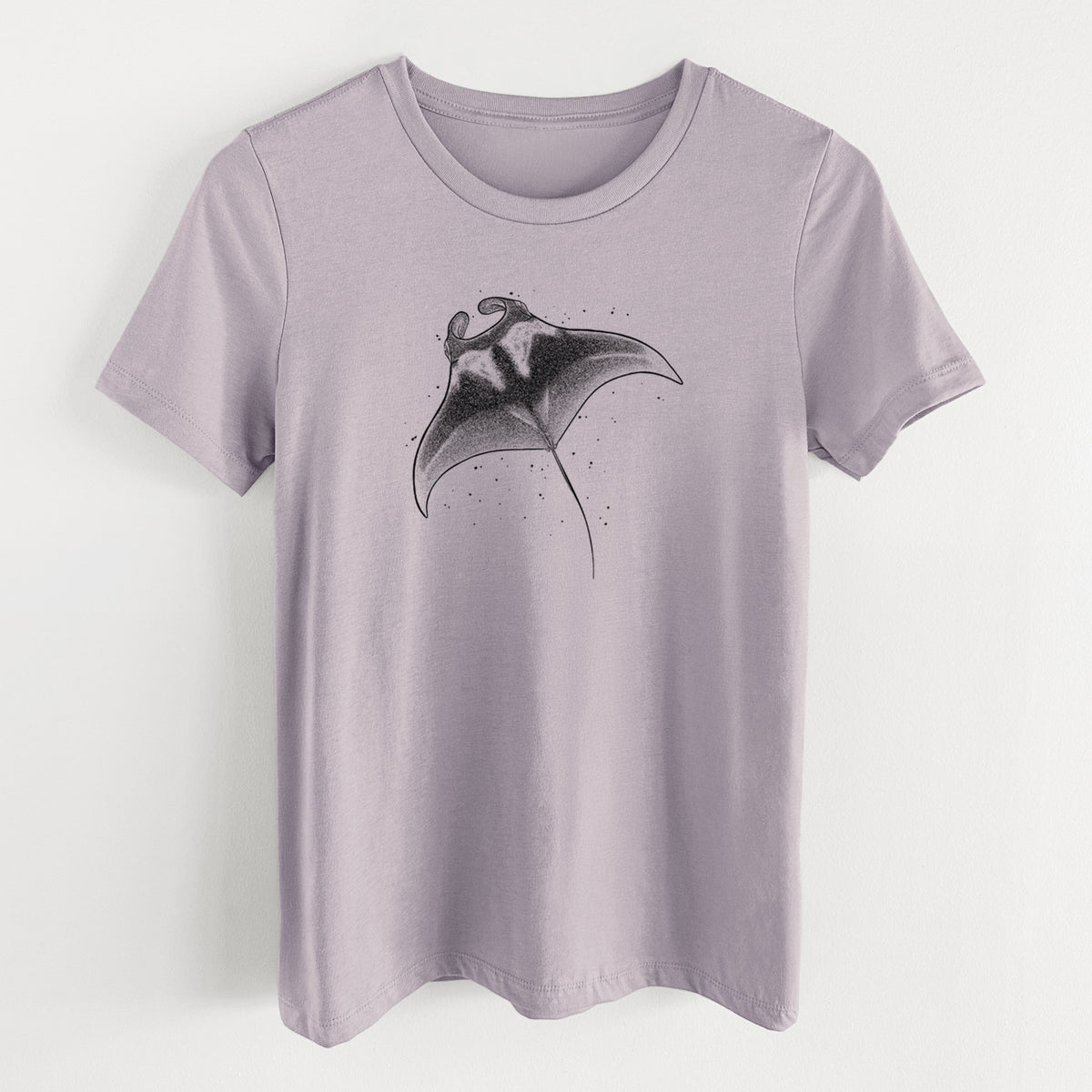 Light violet women's relaxed fit cotton t-shirt laid flat, printed with a black ink illustration of a manta ray gliding.