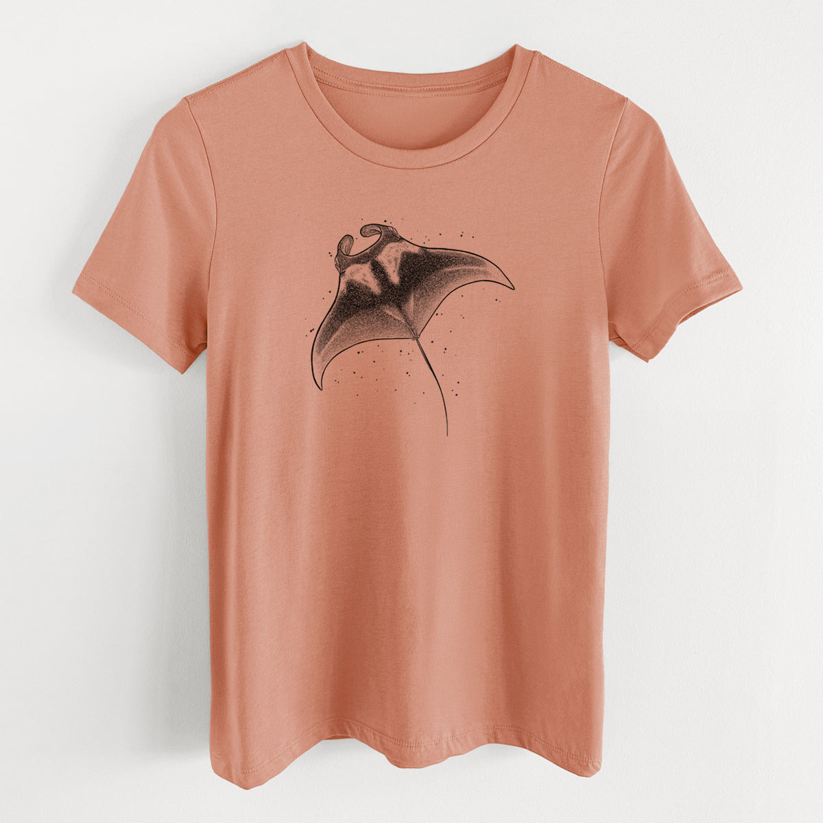 Terracotta orange women's relaxed fit cotton t-shirt laid flat, printed with a black ink illustration of a manta ray gliding.