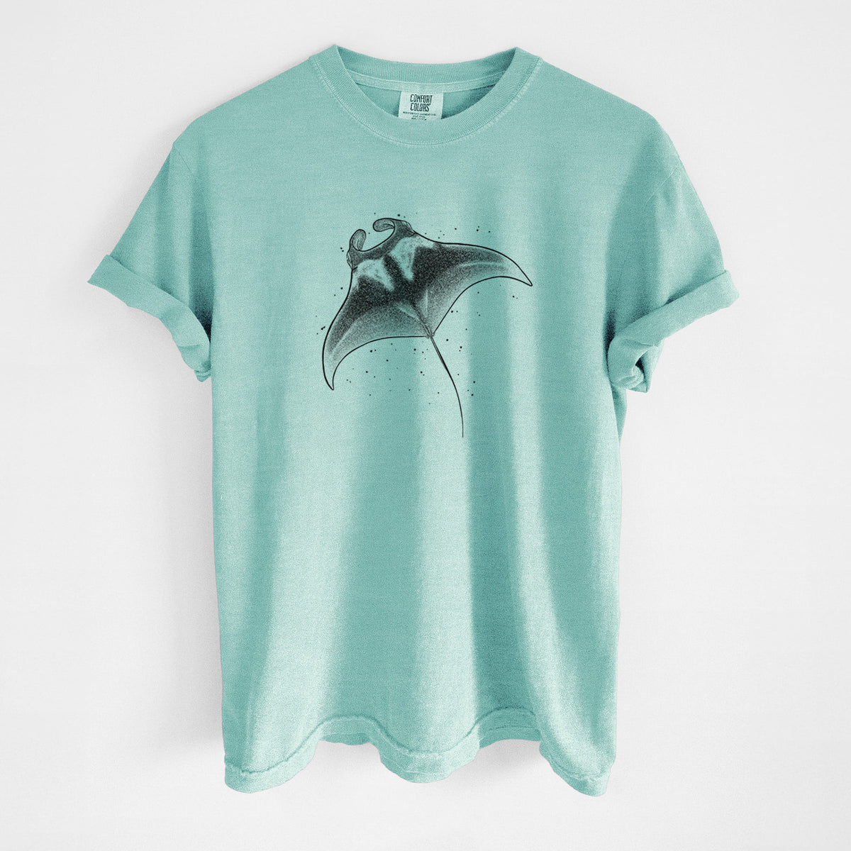 Chalky mint Comfort Colors t-shirt laid flat, printed with a black ink illustration of a manta ray gliding.