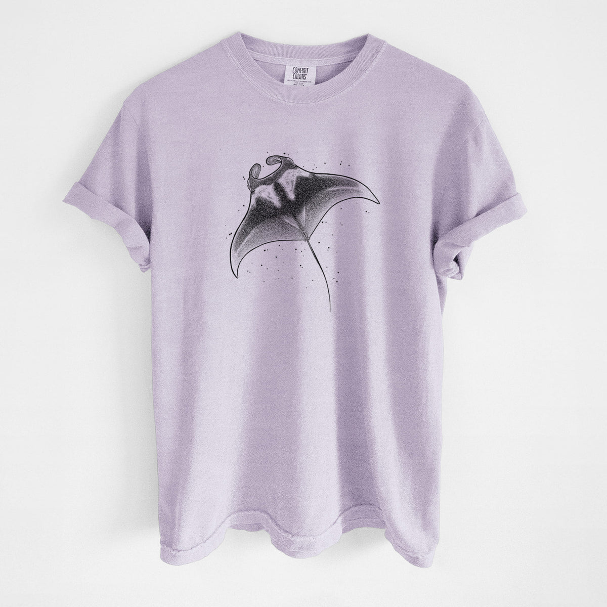 Orchid purple Comfort Colors t-shirt laid flat, printed with a black ink illustration of a manta ray gliding.