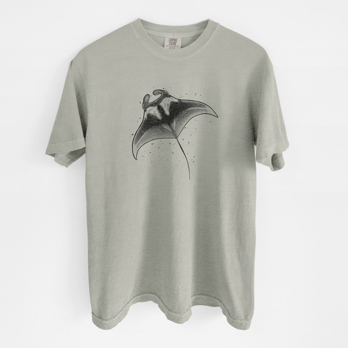 Sandstone beige Comfort Colors t-shirt laid flat, printed with a black ink illustration of a manta ray gliding.