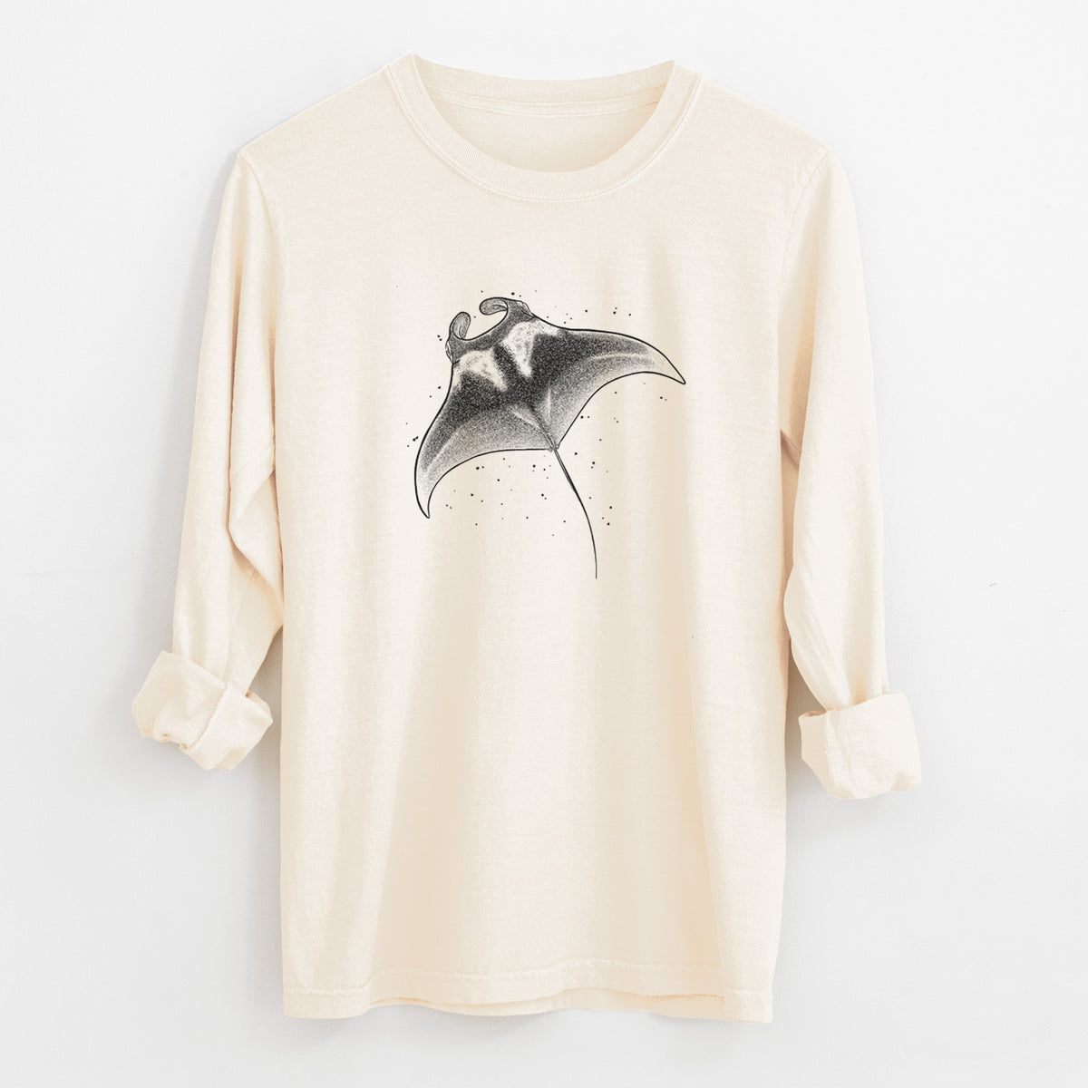 Ivory Comfort Colors long sleeve shirt laid flat with the cuffs rolled, printed with a black ink illustration of a manta ray gliding.