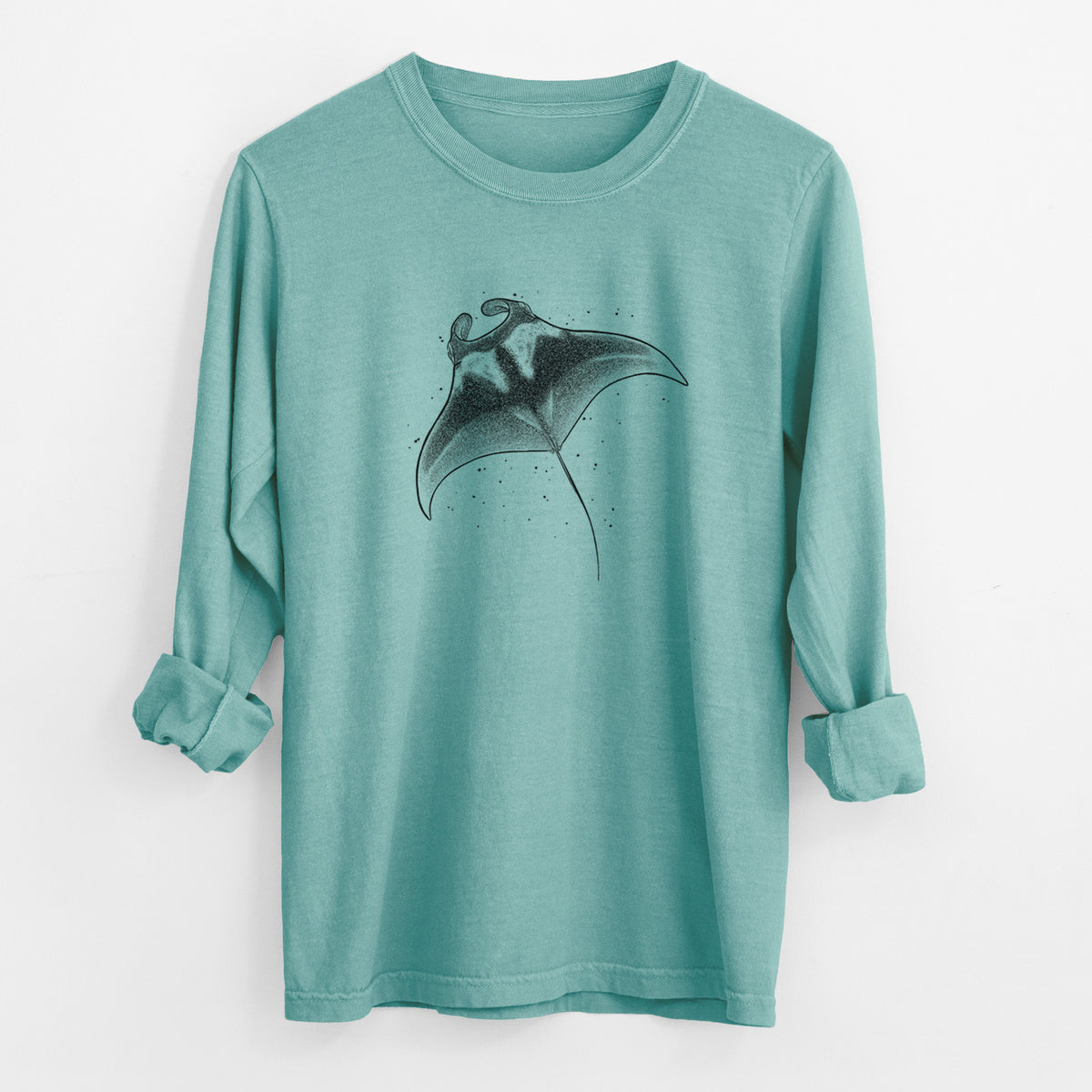 Reef green Comfort Colors long sleeve shirt laid flat with the cuffs rolled, printed with a black ink illustration of a manta ray gliding.