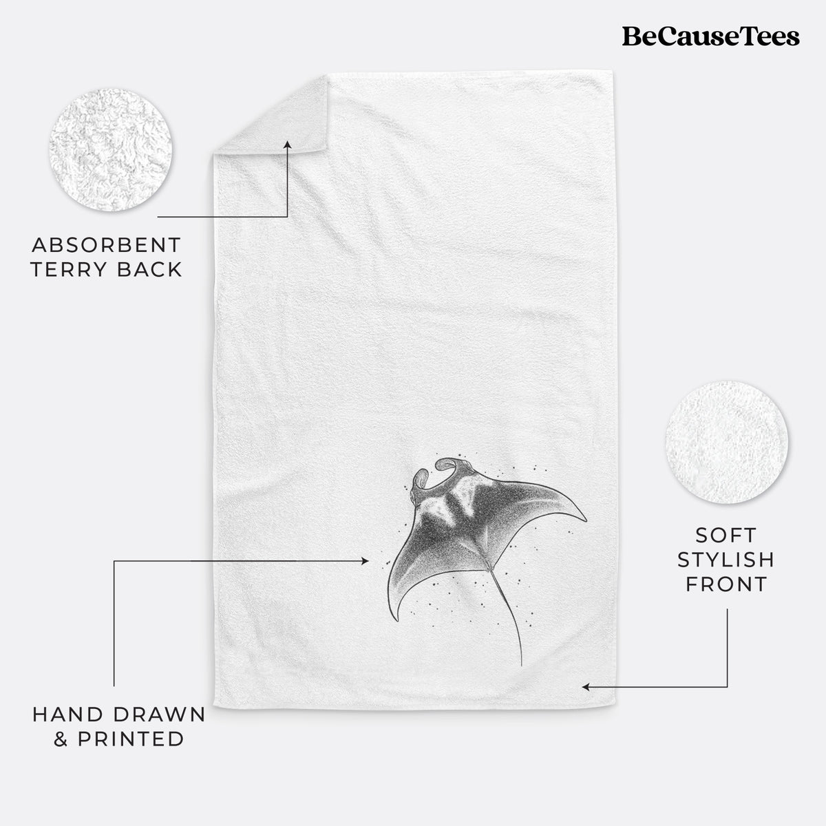 White hand towel printed with a black ink illustration of a manta ray gliding.