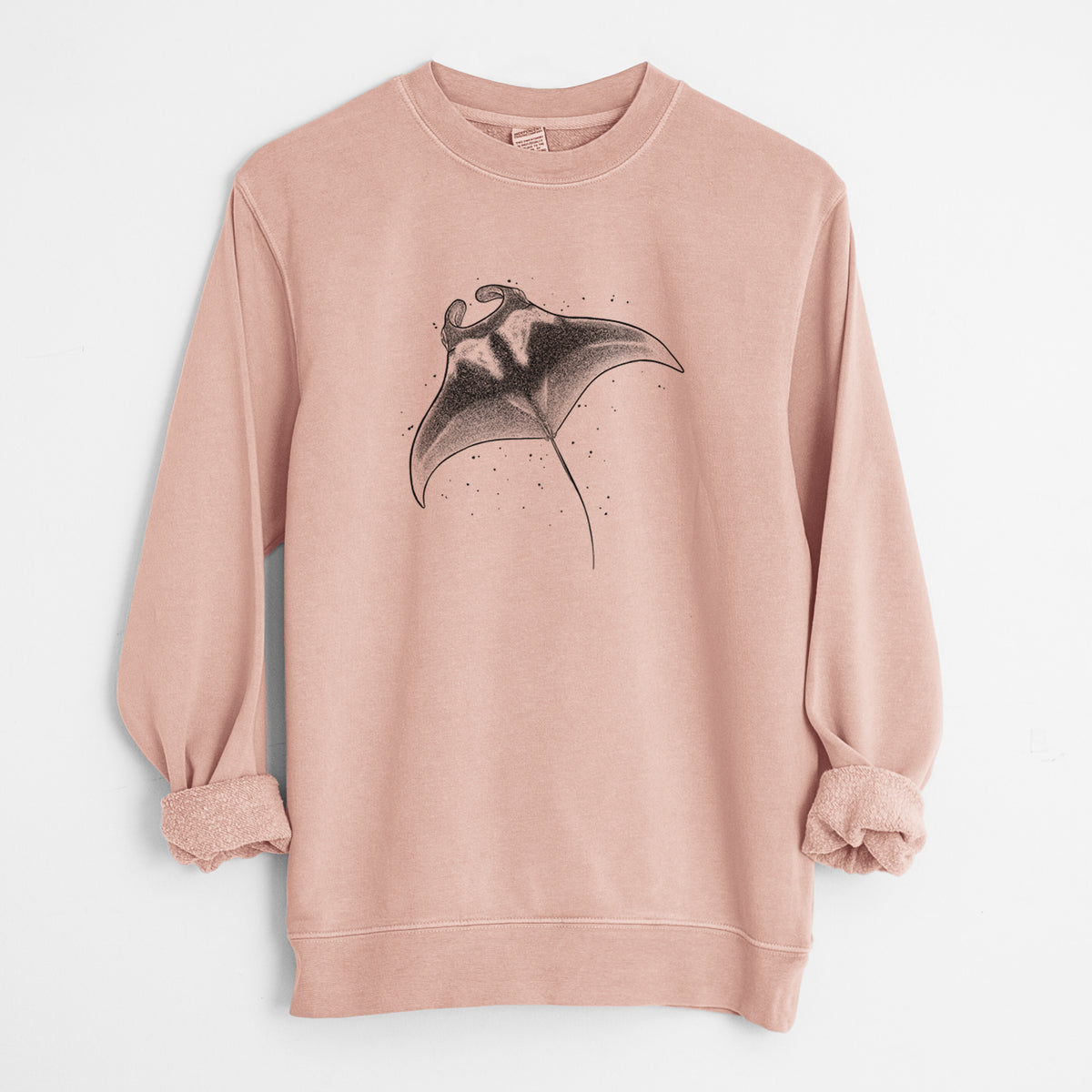 Dusty pink pigment dyed crewneck sweatshirt laid flat with the sleeves rolled, printed with a black ink illustration of a manta ray gliding.