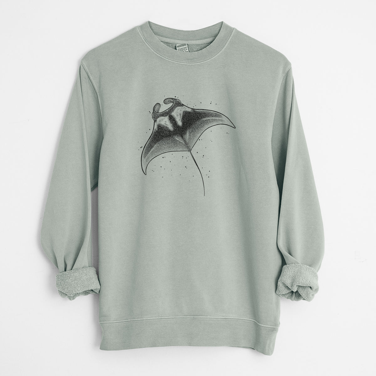 Sage green pigment dyed crewneck sweatshirt laid flat with the sleeves rolled, printed with a black ink illustration of a manta ray gliding.