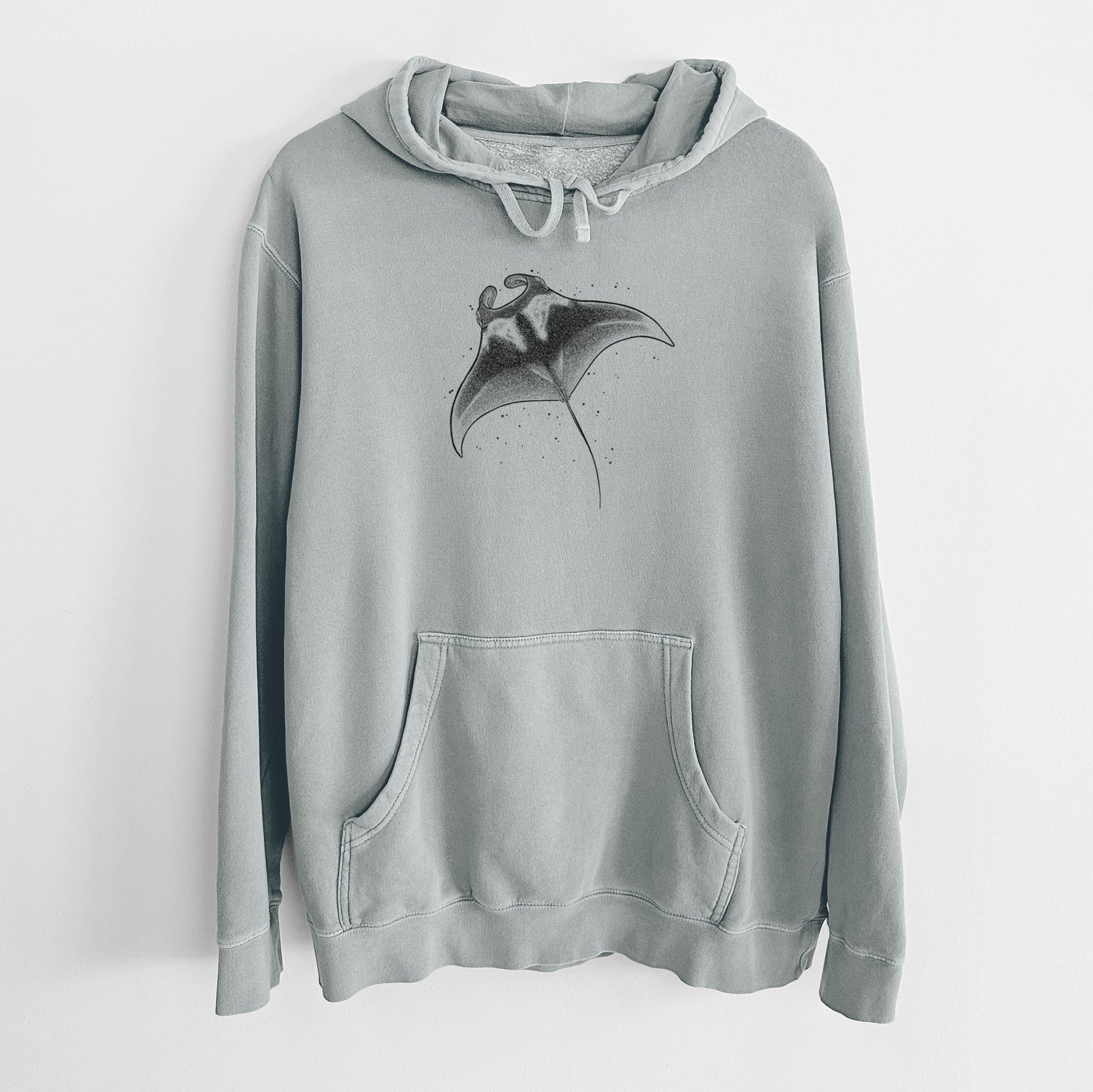 Sage green pigment dyed hoodie laid flat, printed with a black ink illustration of a manta ray gliding.