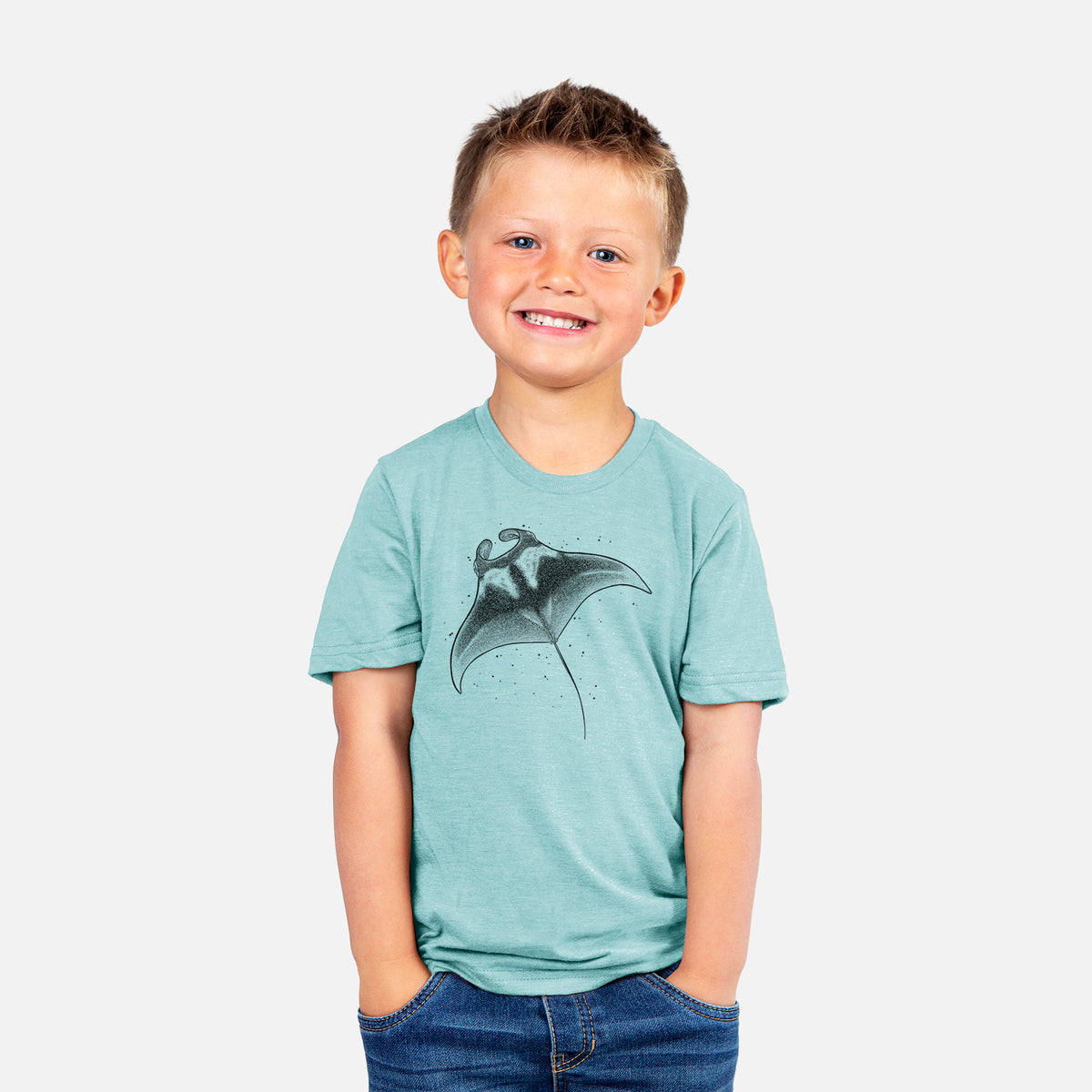 Smiling boy wearing a youth t-shirt printed with a black ink illustration of a manta ray gliding.