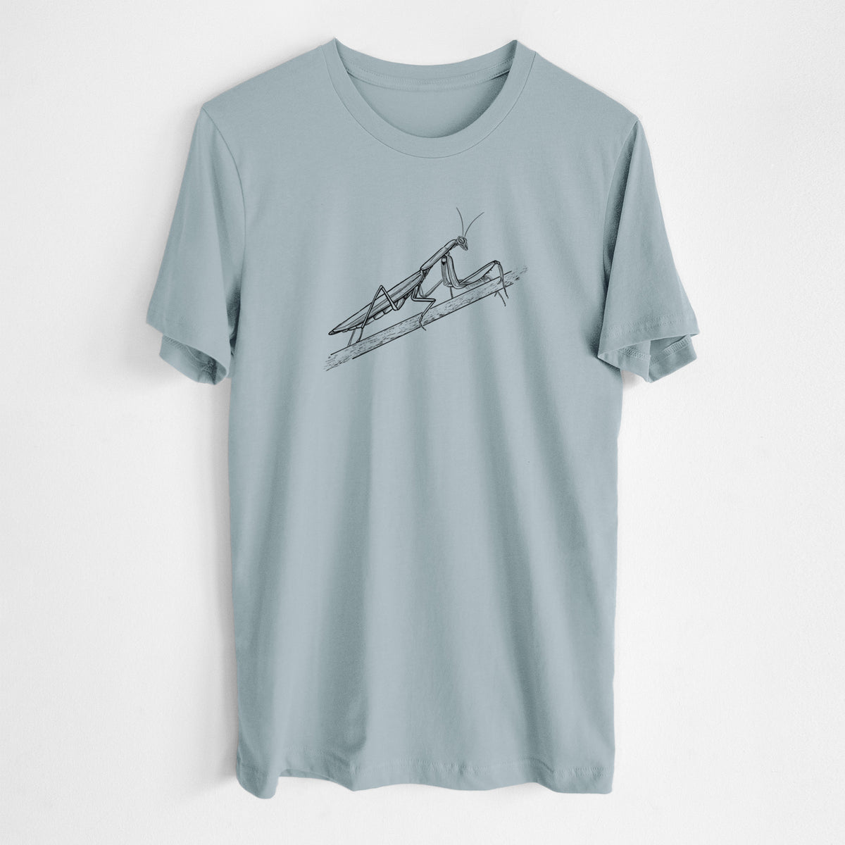 Vintage denim lightweight cotton t-shirt laid flat, printed with a detailed black ink illustration of a praying mantis on a stem.