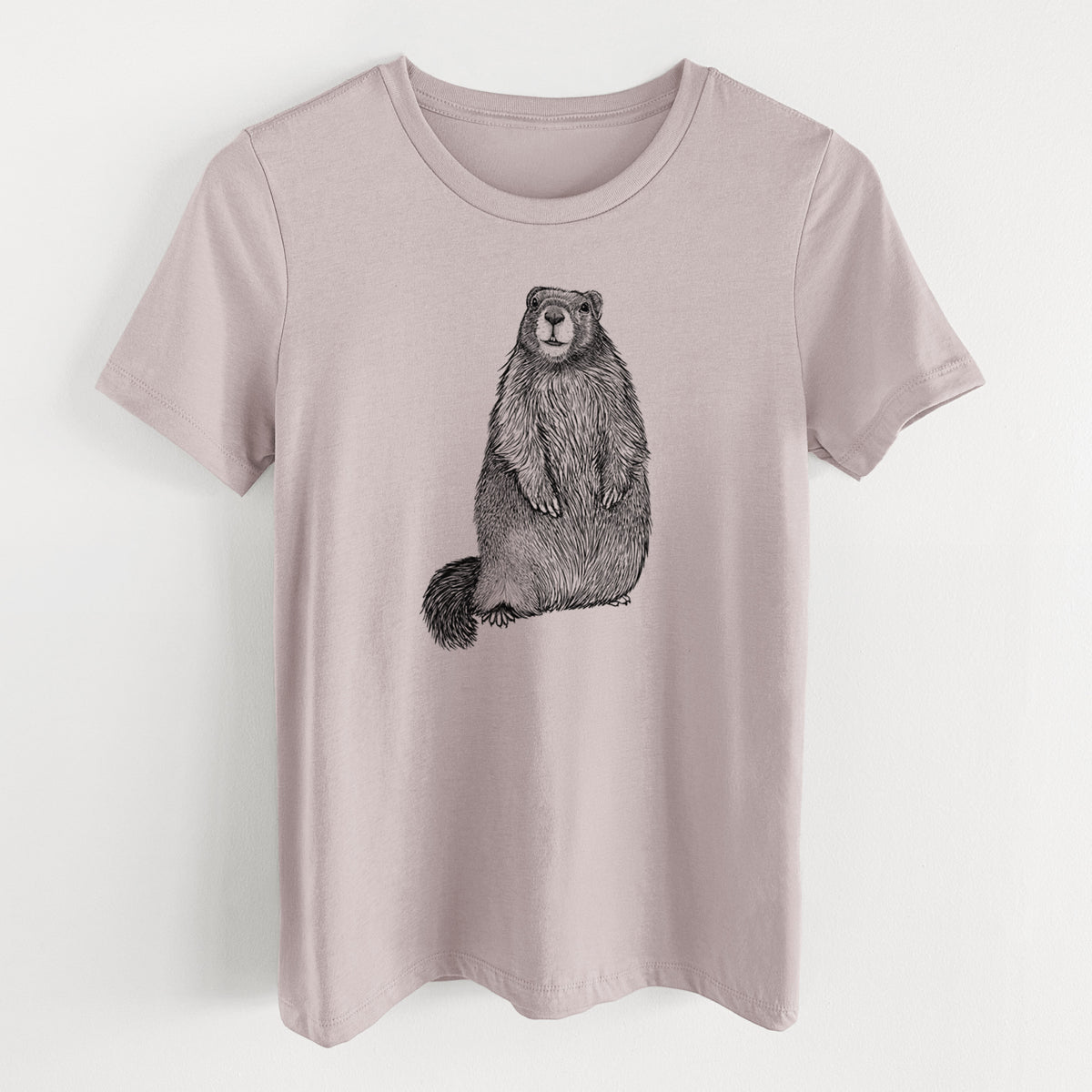 Pink gravel women's relaxed fit cotton t-shirt laid flat, printed with a detailed black ink illustration of a marmot standing upright.