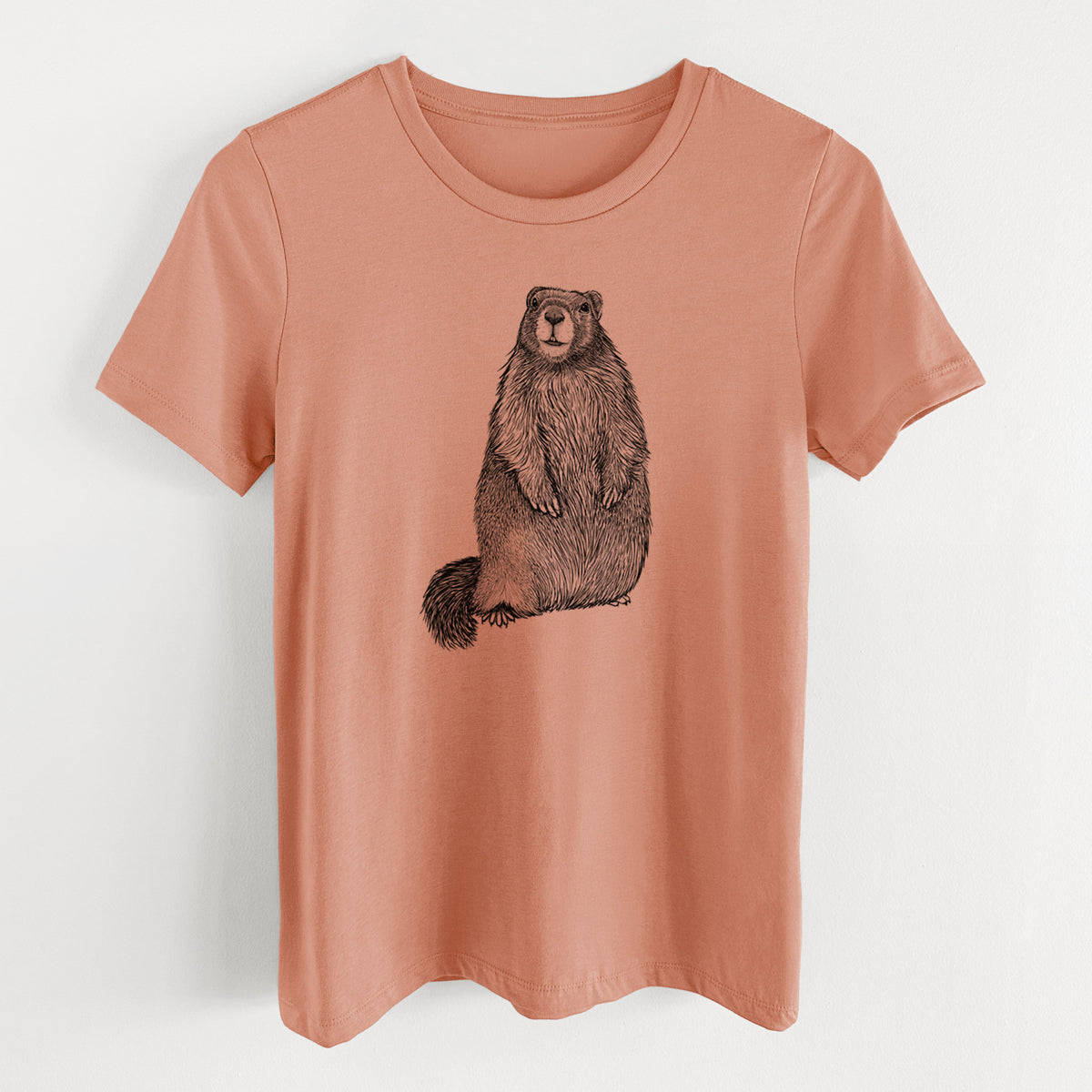 Terracotta orange women's relaxed fit cotton t-shirt laid flat, printed with a detailed black ink illustration of a marmot standing upright.