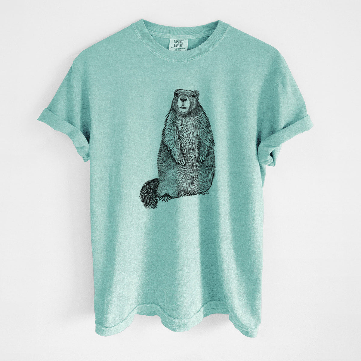 Chalky mint Comfort Colors t-shirt laid flat, printed with a detailed black ink illustration of a marmot standing upright.