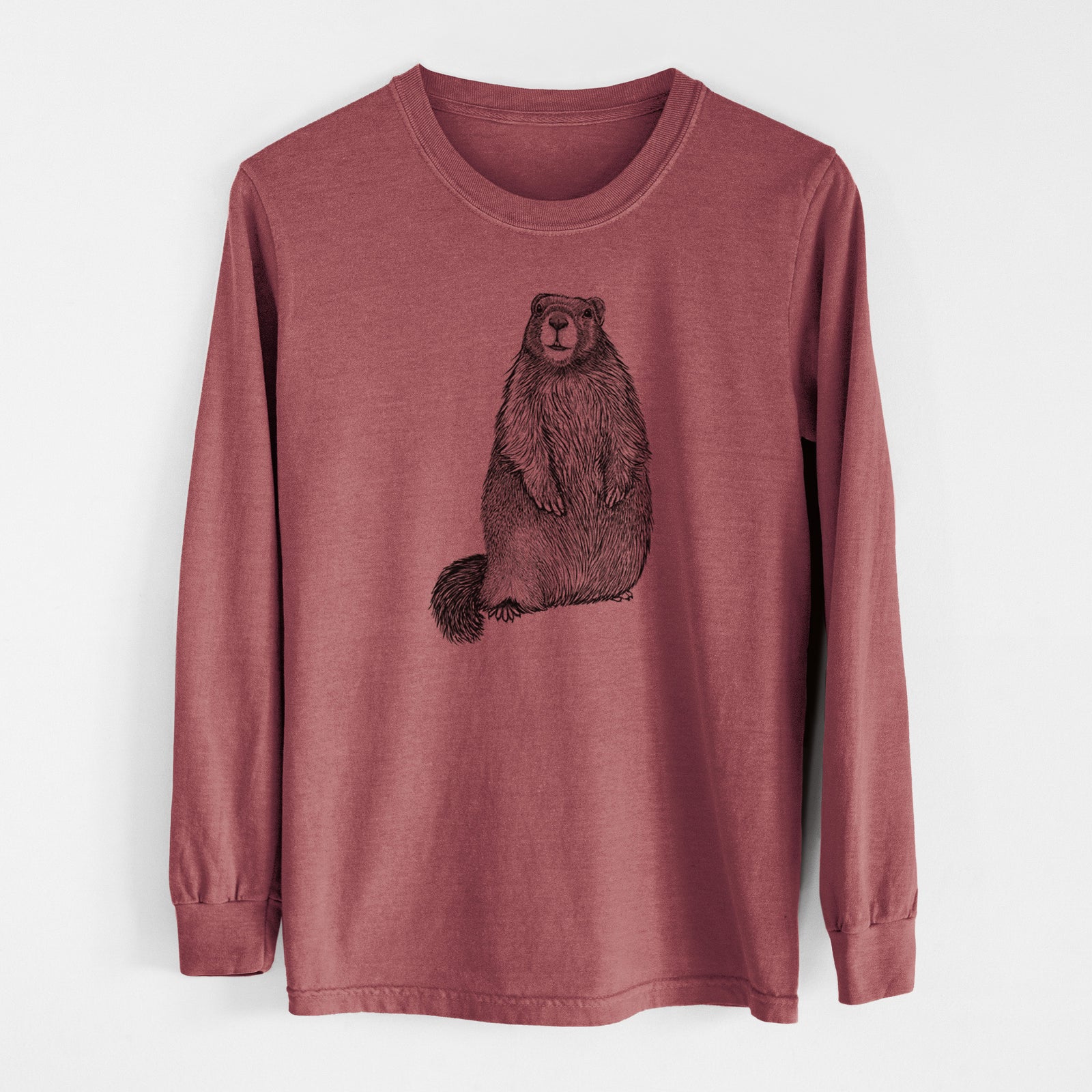Ivory Comfort Colors long sleeve shirt laid flat, printed with a detailed black ink illustration of a marmot standing upright.
