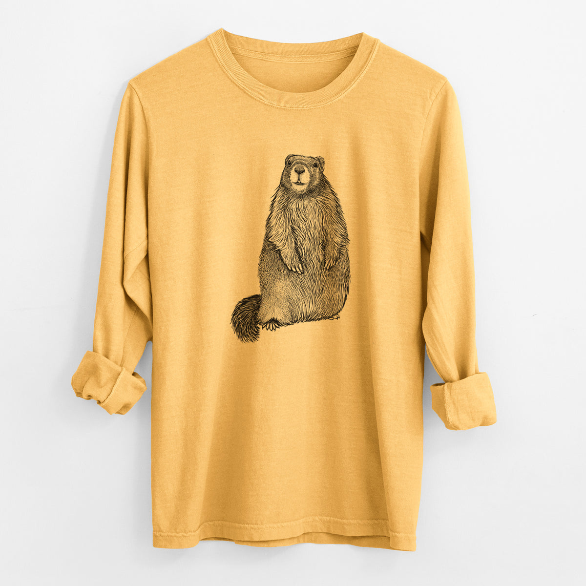 Golden wheat yellow Comfort Colors long sleeve shirt laid flat with the cuffs rolled, printed with a detailed black ink illustration of a marmot standing upright.