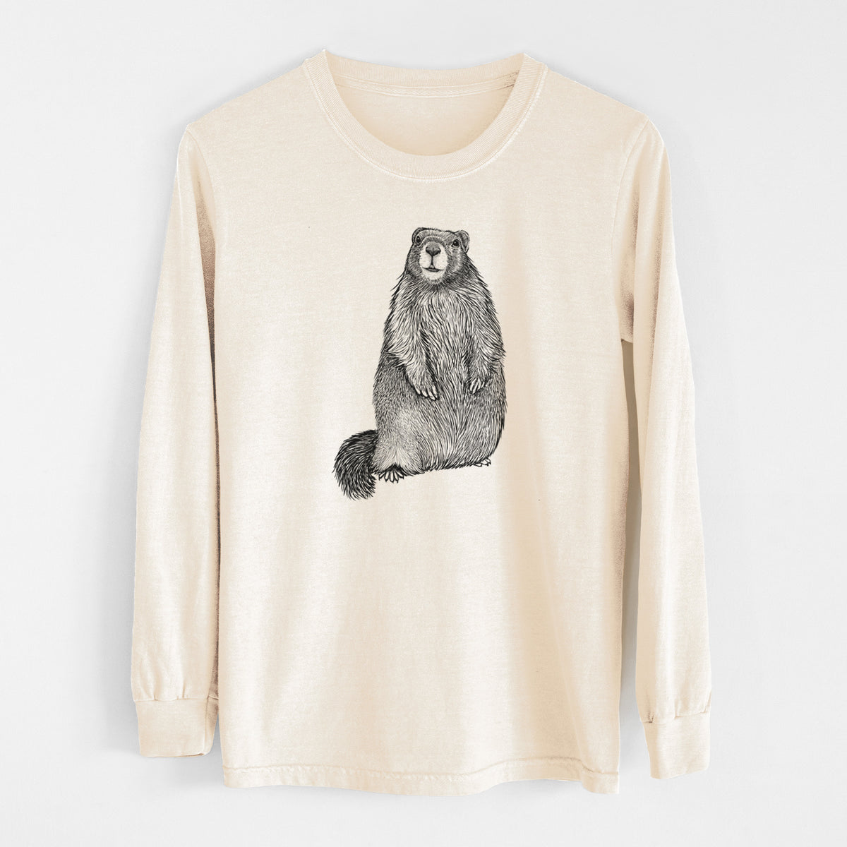 Ivory Comfort Colors long sleeve shirt laid flat, printed with a detailed black ink illustration of a marmot standing upright.