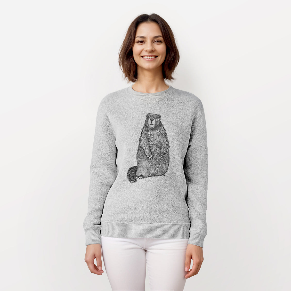 Woman wearing a knit sweatshirt printed with a detailed black ink illustration of a marmot standing upright.