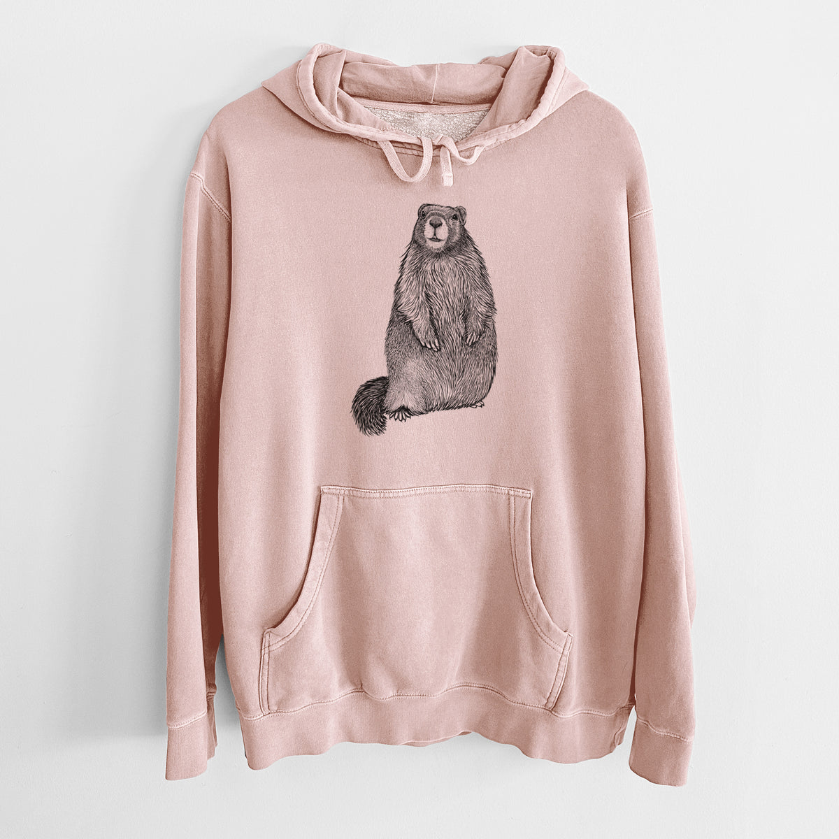 Dusty pink pigment dyed hoodie laid flat, printed with a detailed black ink illustration of a marmot standing upright.