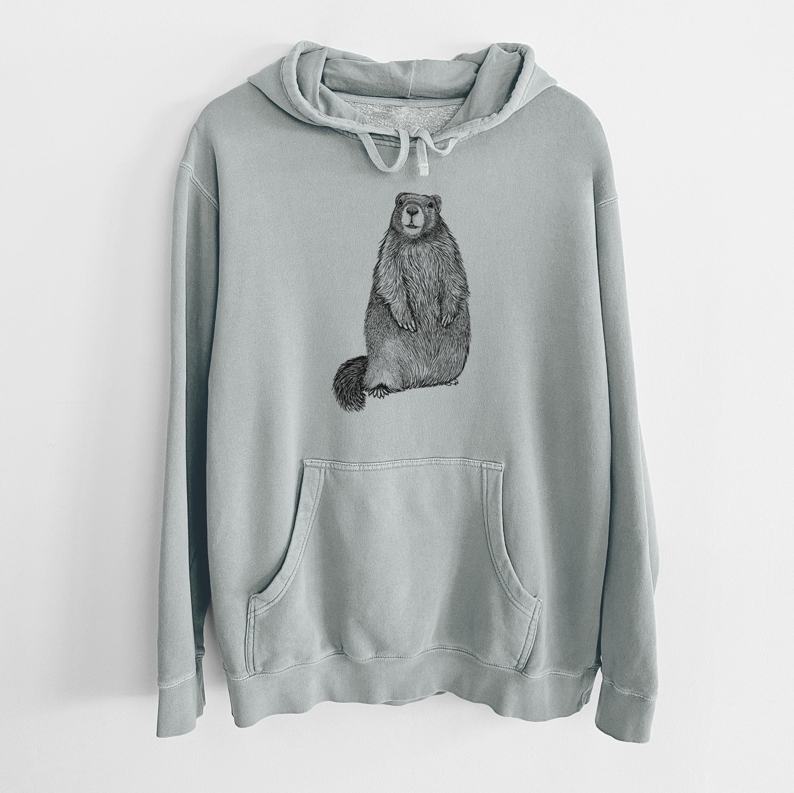 Sage green pigment dyed hoodie laid flat, printed with a detailed black ink illustration of a marmot standing upright.