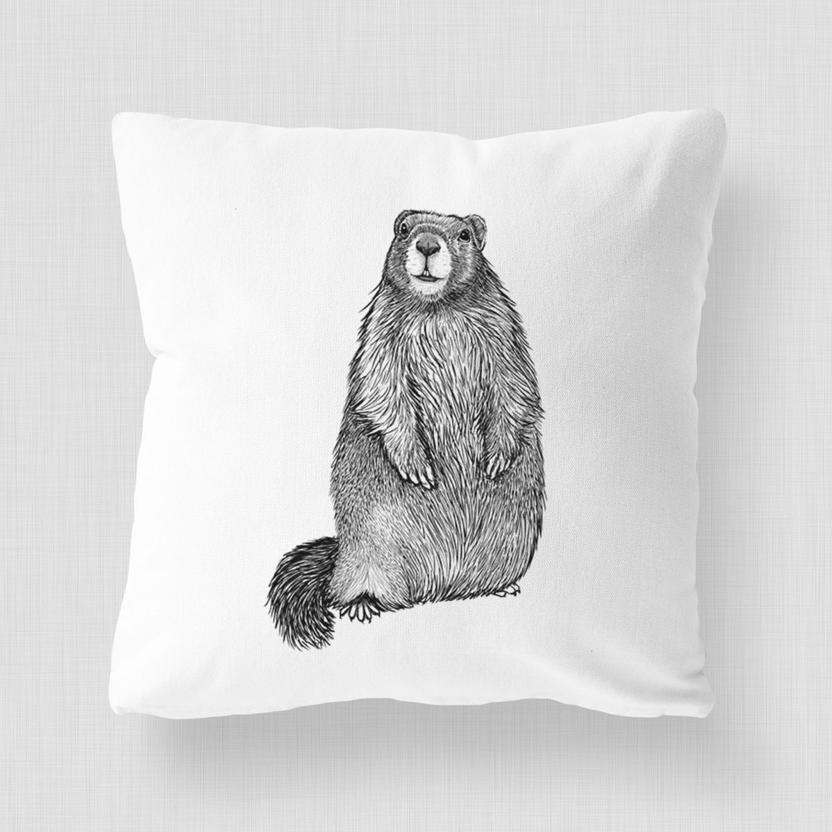 White pillow cover printed with a detailed black ink illustration of a marmot standing upright.