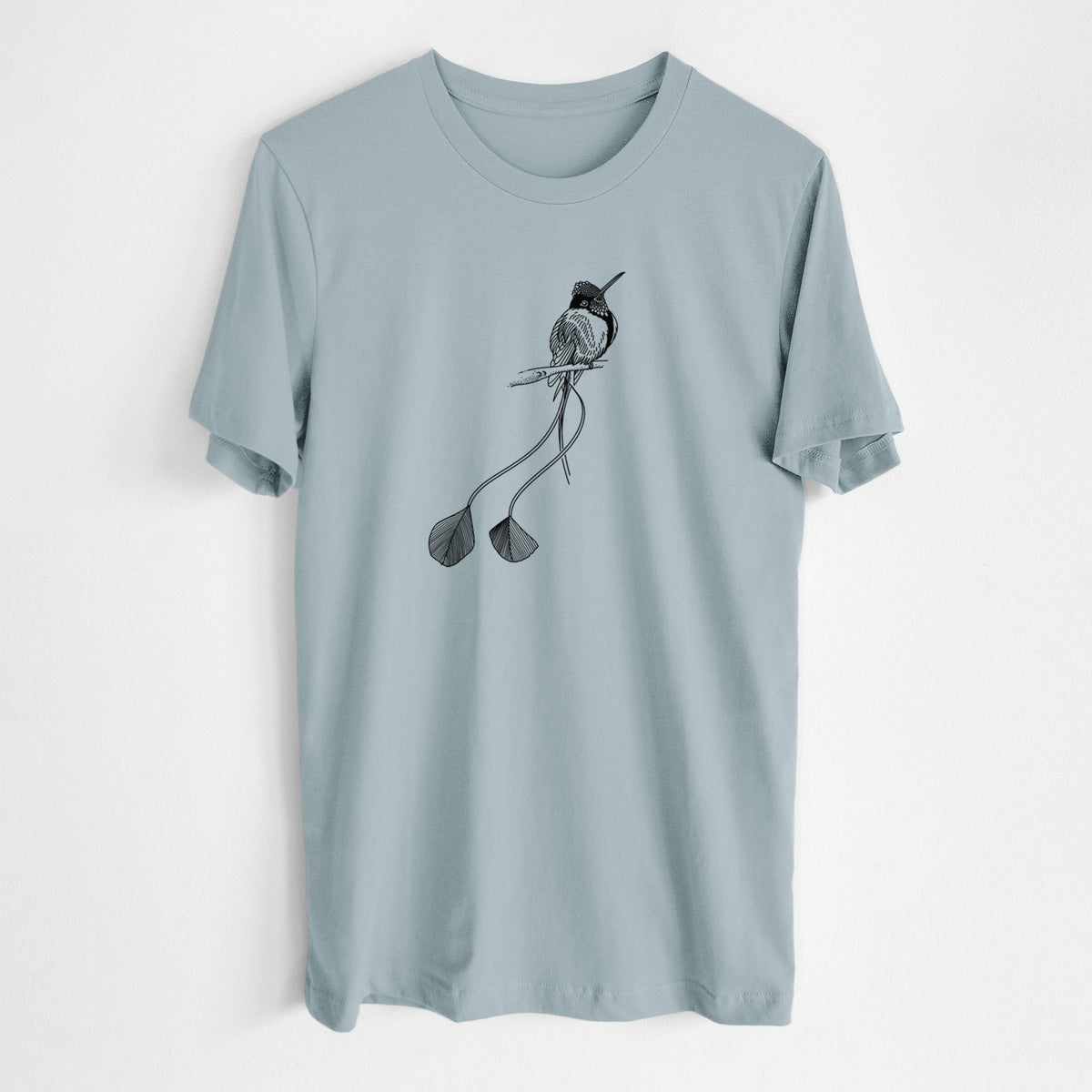 Vintage denim lightweight cotton t-shirt laid flat, printed with a black ink illustration of a marvelous spatuletail hummingbird perched, with its two long racket-tipped tail feathers.