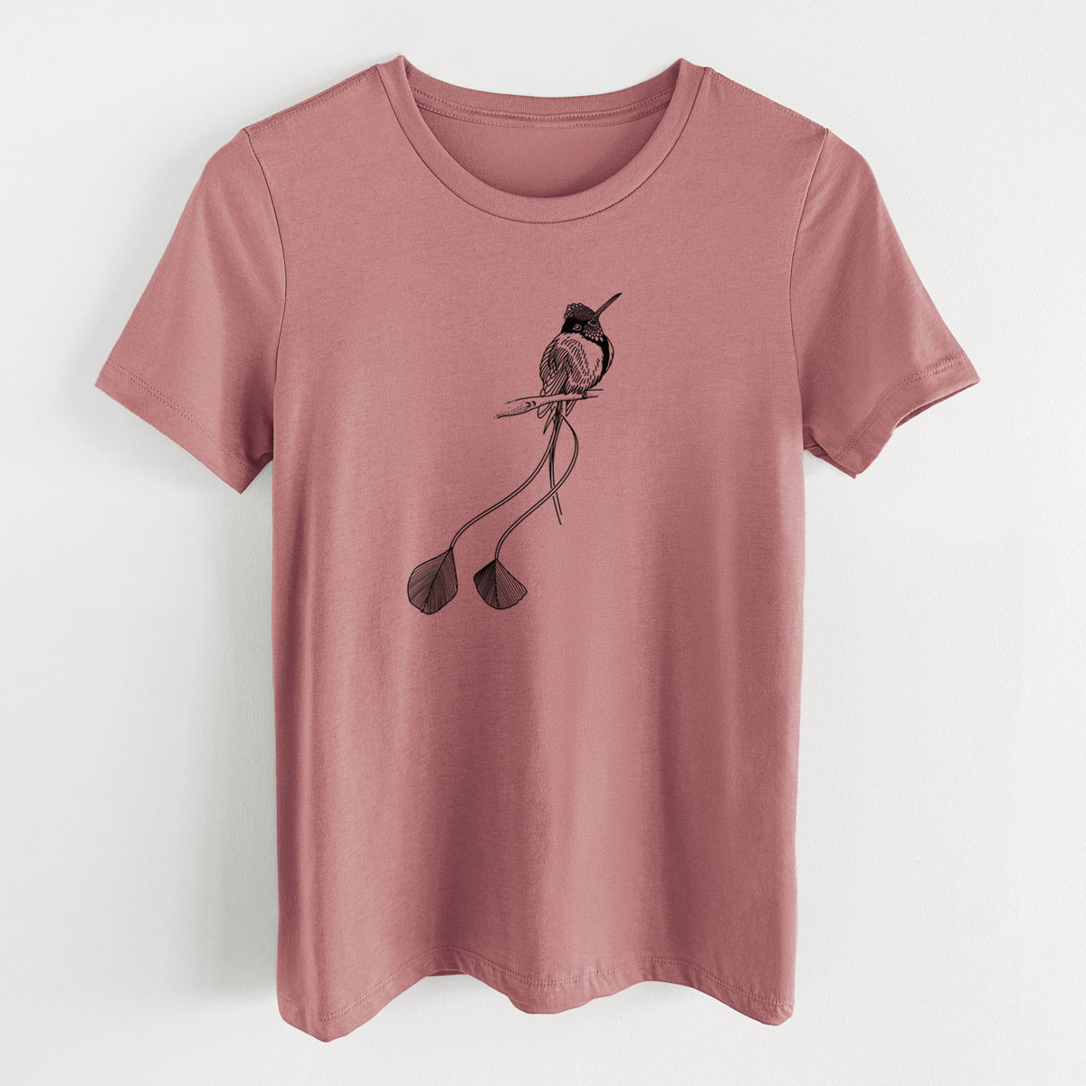 Mauve pink women's relaxed fit cotton t-shirt laid flat, printed with a black ink illustration of a marvelous spatuletail hummingbird perched, with its two long racket-tipped tail feathers.