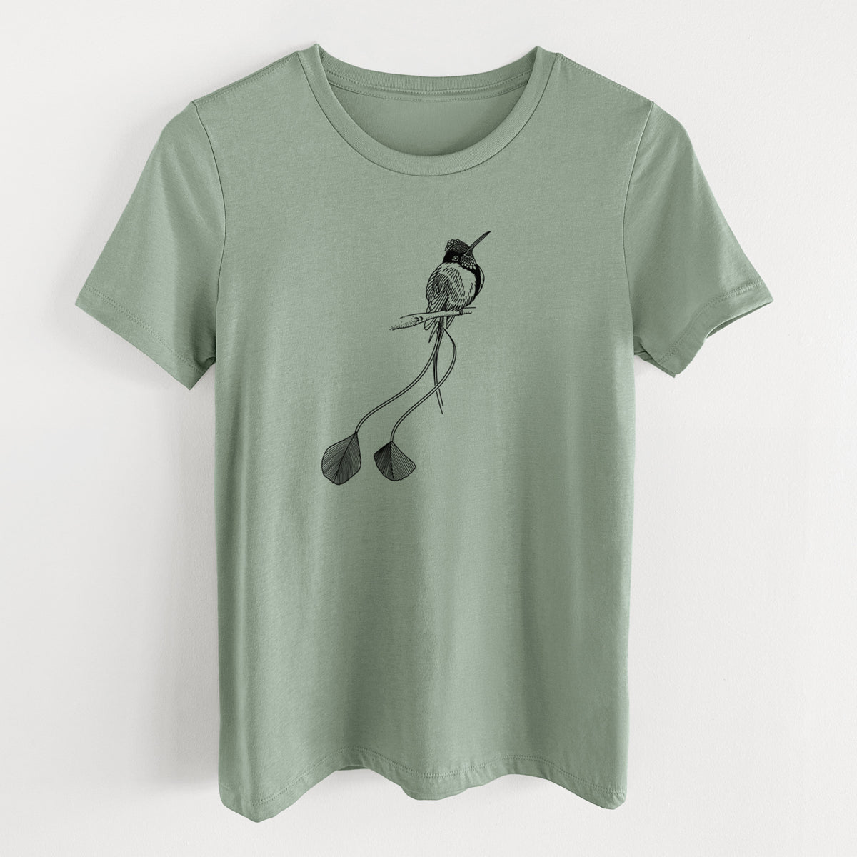 Sage green women's relaxed fit cotton t-shirt laid flat, printed with a black ink illustration of a marvelous spatuletail hummingbird perched, with its two long racket-tipped tail feathers.