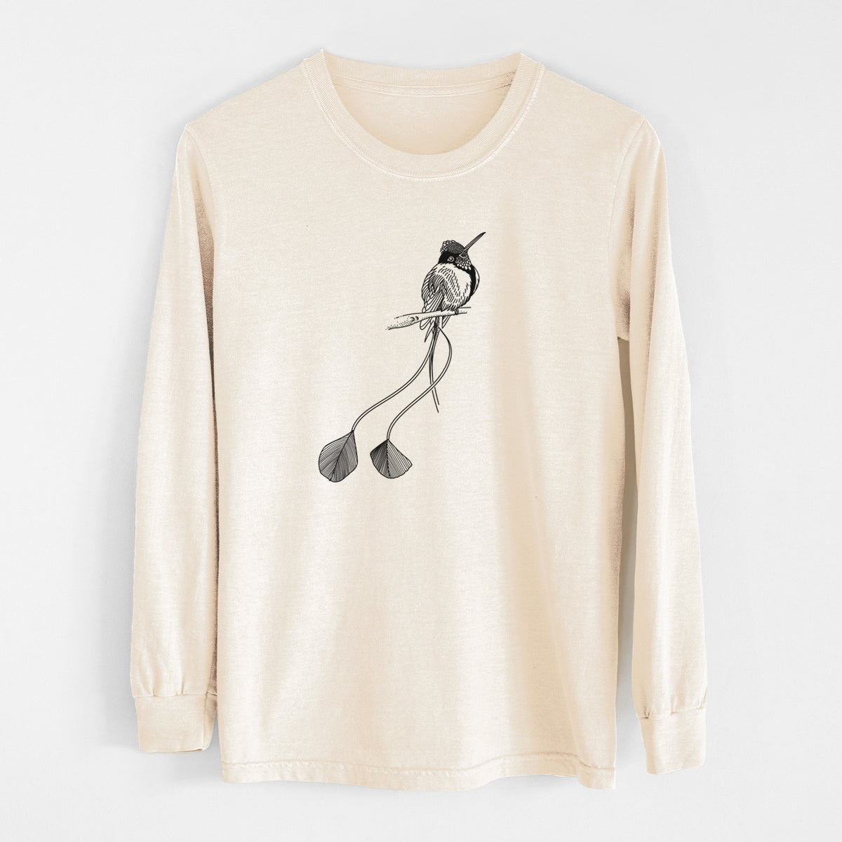 Ivory Comfort Colors long sleeve shirt laid flat, printed with a black ink illustration of a marvelous spatuletail hummingbird perched, with its two long racket-tipped tail feathers.