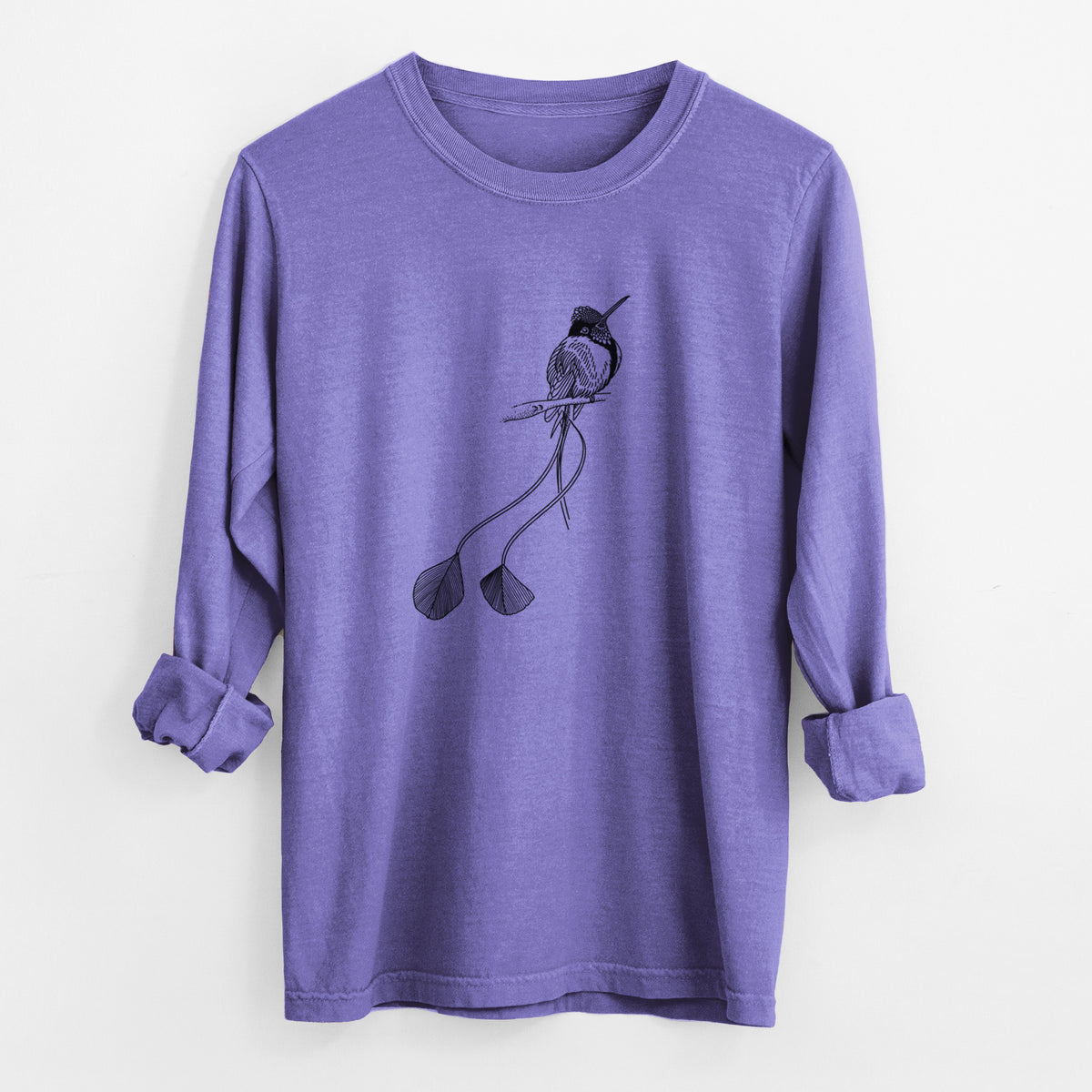 Violet purple Comfort Colors long sleeve shirt laid flat with the cuffs rolled, printed with a black ink illustration of a marvelous spatuletail hummingbird perched, with its two long racket-tipped tail feathers.