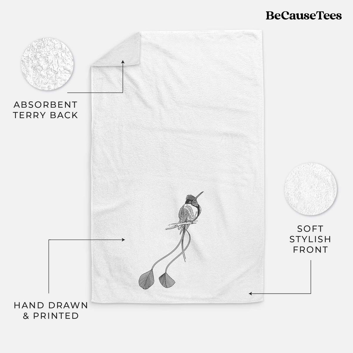 White hand towel printed with a black ink illustration of a marvelous spatuletail hummingbird perched, with its two long racket-tipped tail feathers.