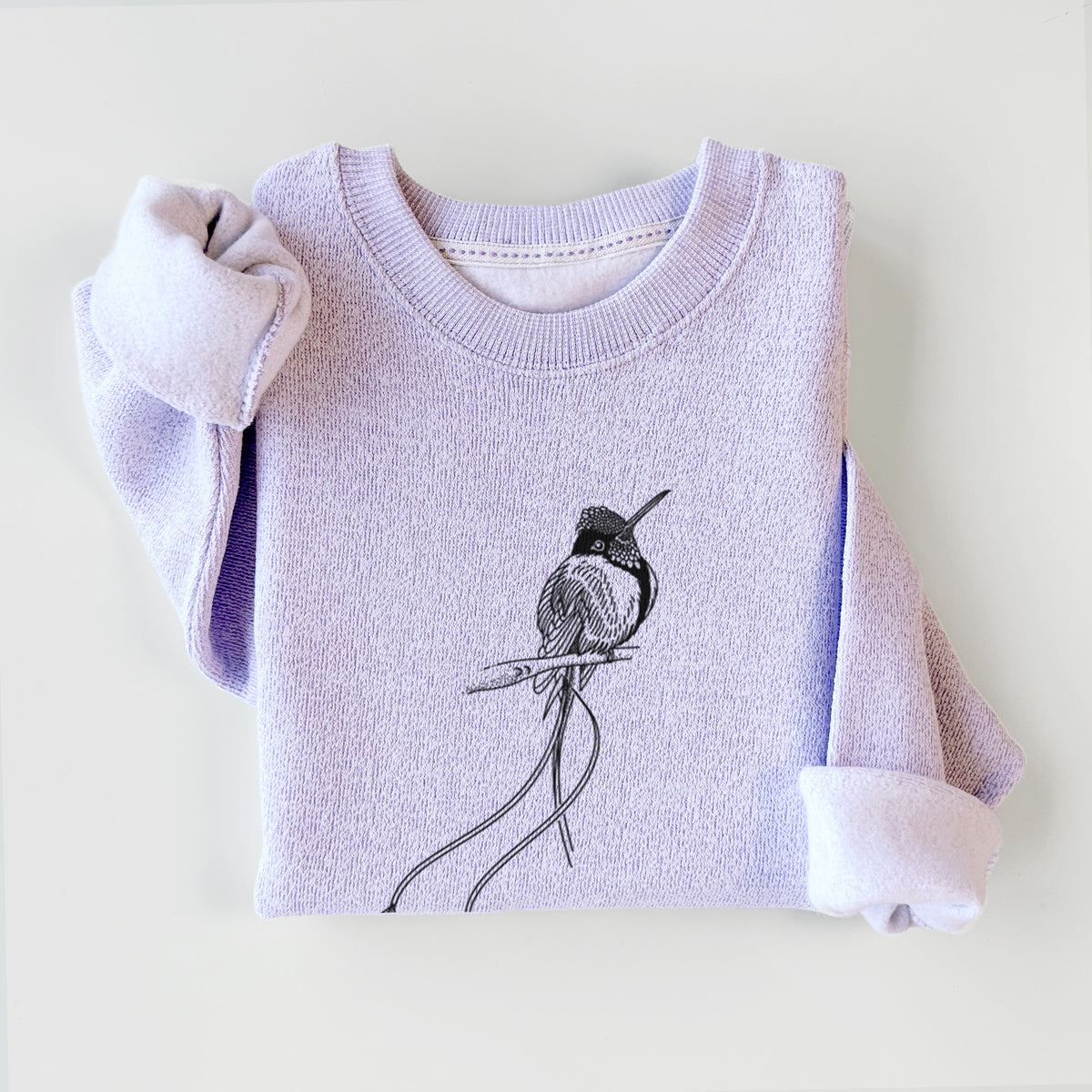 Ice purple knit sweatshirt printed with a black ink illustration of a marvelous spatuletail hummingbird perched, with its two long racket-tipped tail feathers, styled flat.