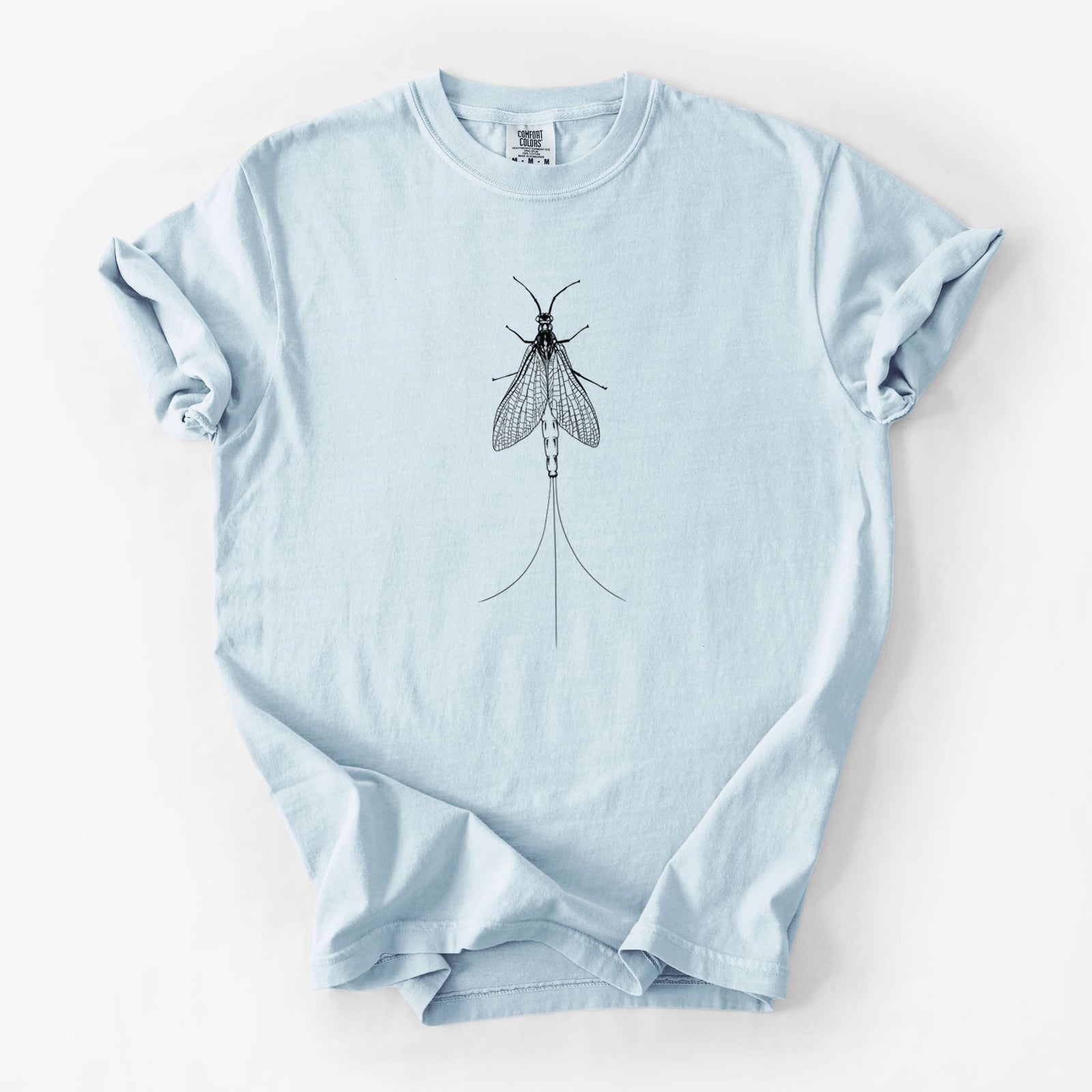 Blue jean Comfort Colors t-shirt laid flat, printed with a detailed black ink illustration of a mayfly with its wings raised and long tail filaments.