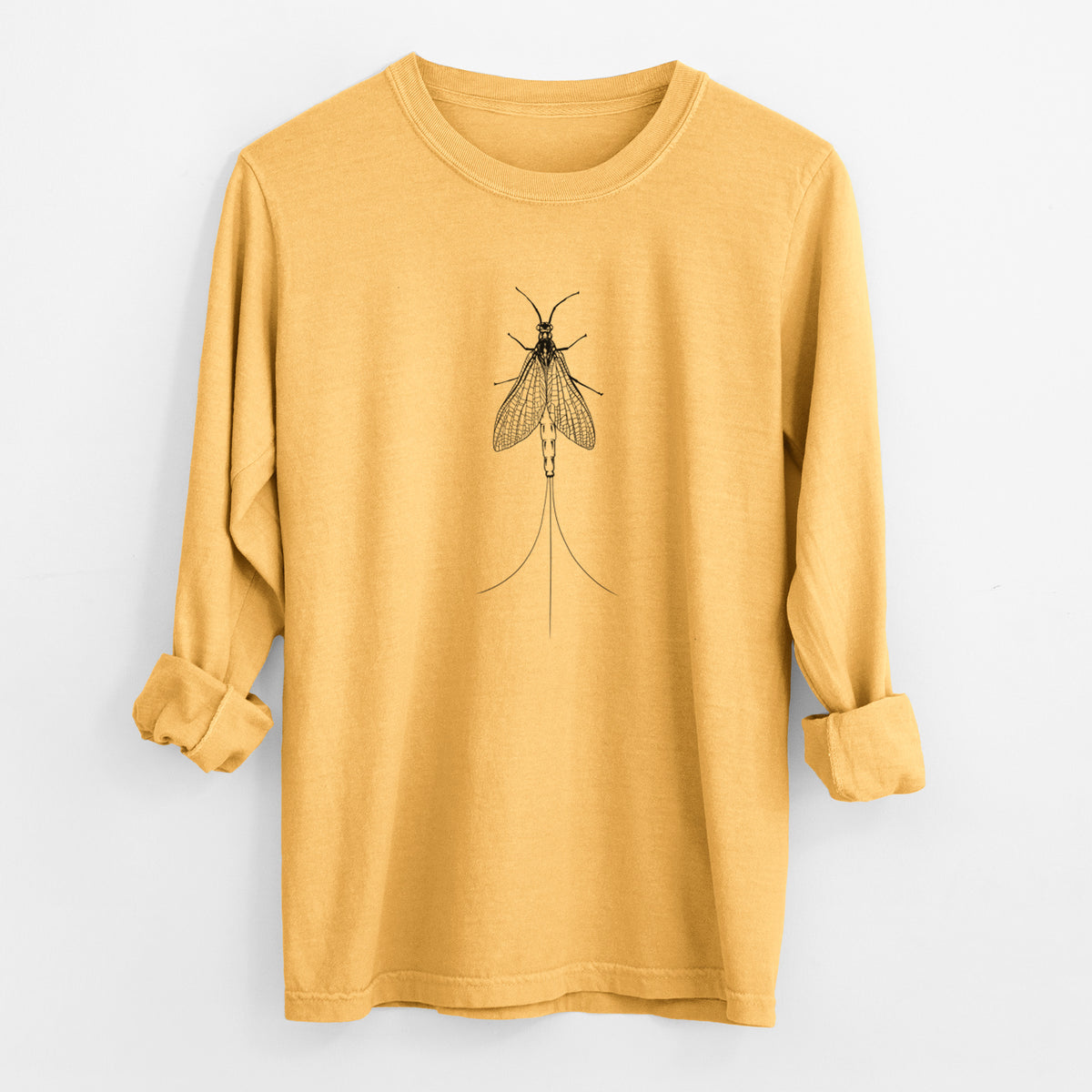Golden wheat yellow Comfort Colors long sleeve shirt laid flat with the cuffs rolled, printed with a detailed black ink illustration of a mayfly with its wings raised and long tail filaments.