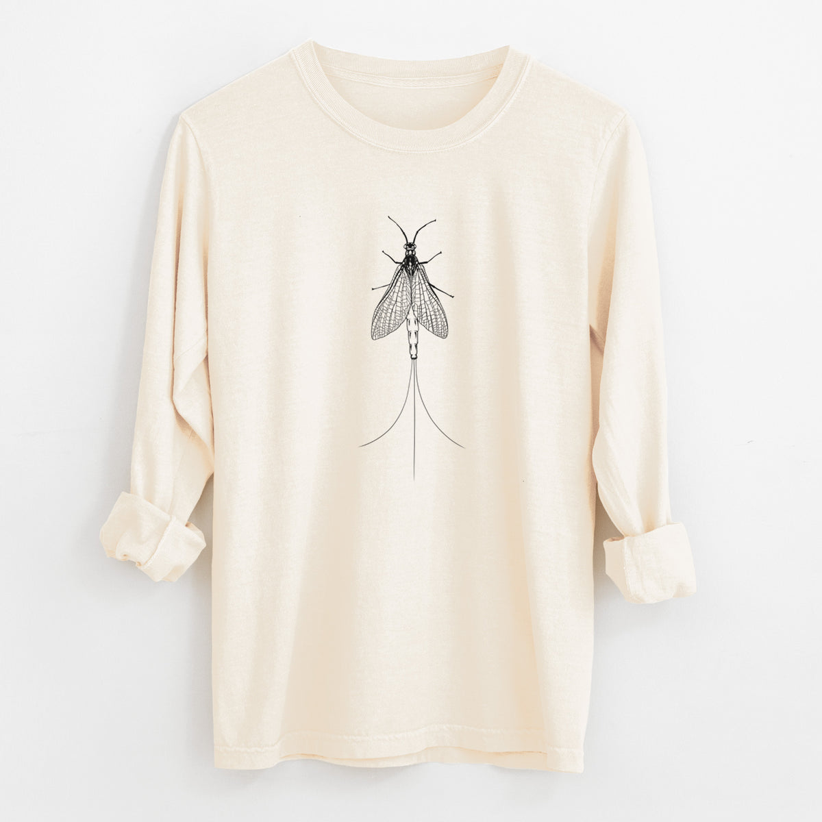 Ivory Comfort Colors long sleeve shirt laid flat with the cuffs rolled, printed with a detailed black ink illustration of a mayfly with its wings raised and long tail filaments.