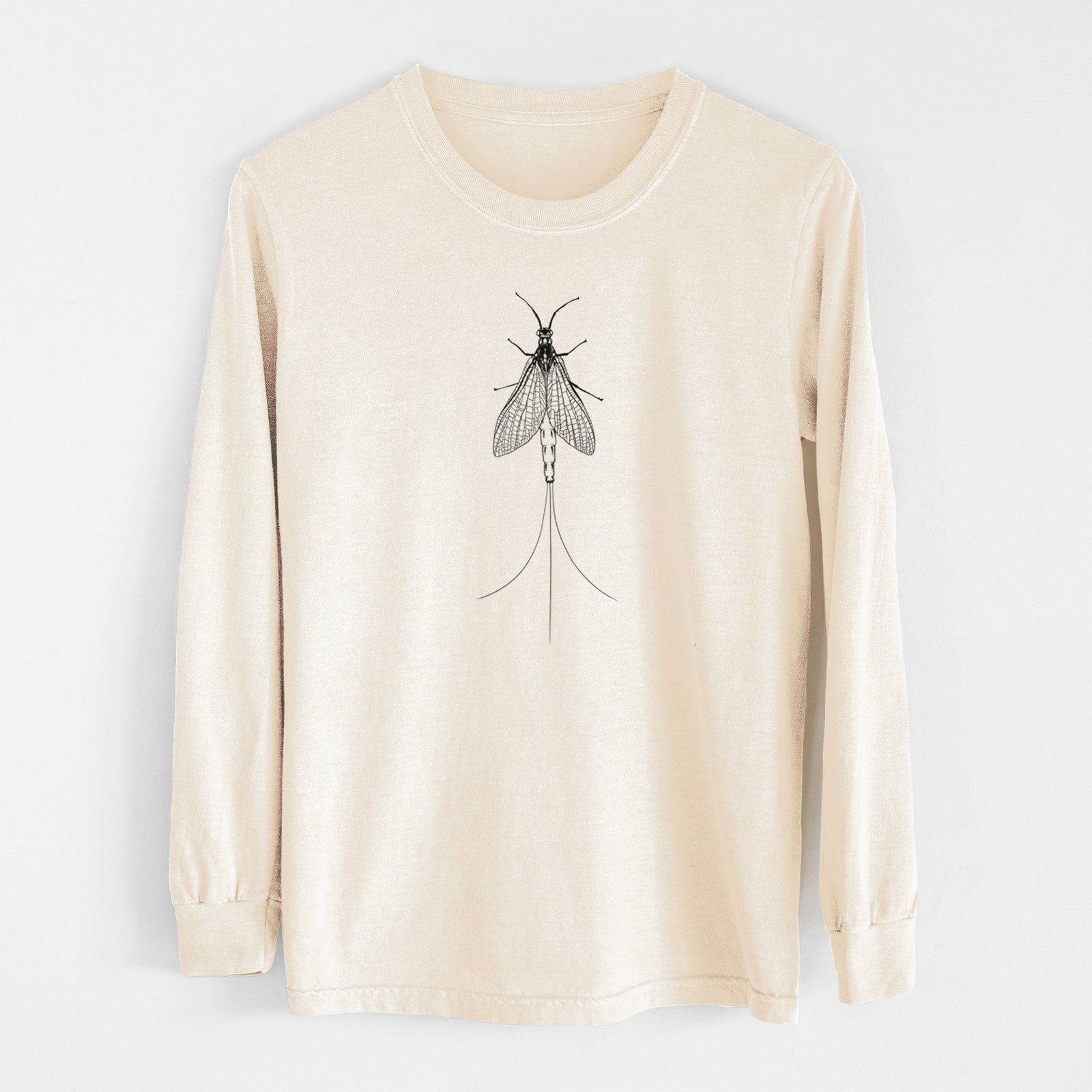 Ivory Comfort Colors long sleeve shirt laid flat, printed with a detailed black ink illustration of a mayfly with its wings raised and long tail filaments.