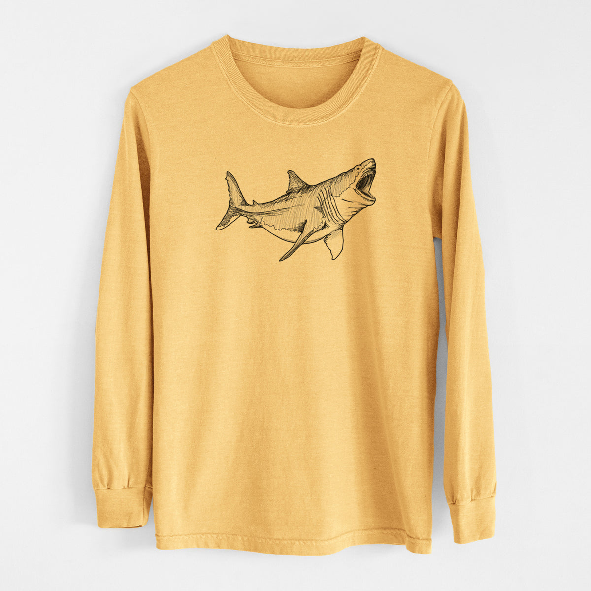 Golden wheat yellow Comfort Colors long sleeve shirt laid flat, printed with a black ink illustration of a megalodon shark with its jaws open.