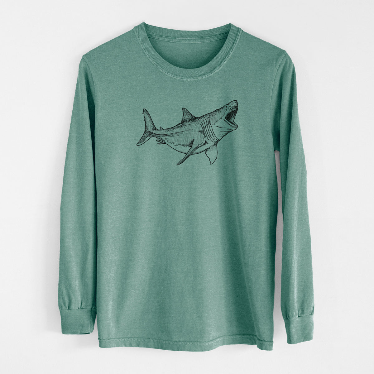 Pine green Comfort Colors long sleeve shirt laid flat, printed with a black ink illustration of a megalodon shark with its jaws open.