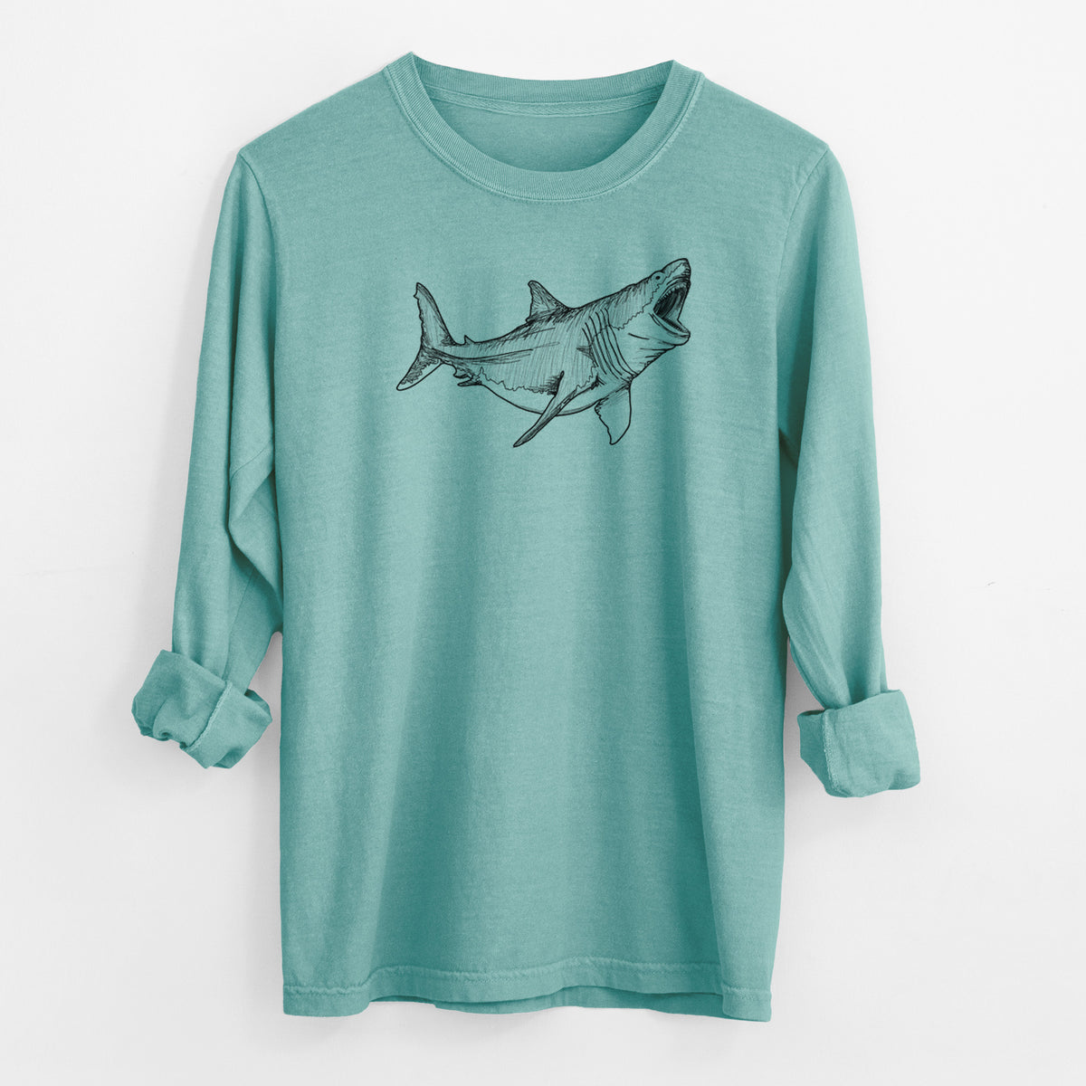 Reef green Comfort Colors long sleeve shirt laid flat with the cuffs rolled, printed with a black ink illustration of a megalodon shark with its jaws open.