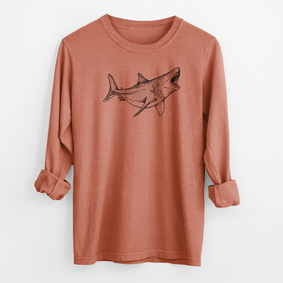 Yam burnt orange Comfort Colors long sleeve shirt laid flat with the cuffs rolled, printed with a black ink illustration of a megalodon shark with its jaws open.