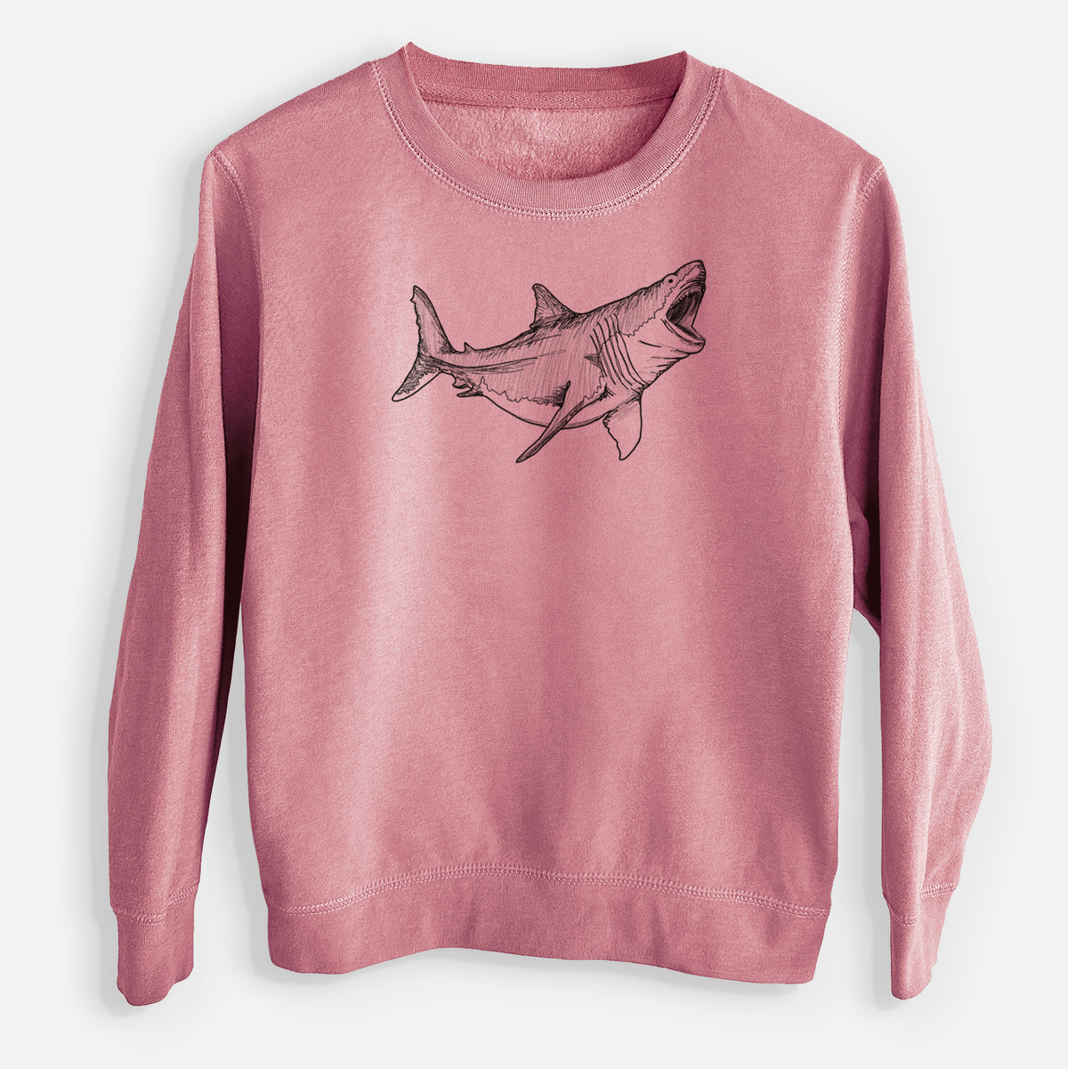 Mauve pink youth crewneck sweatshirt laid flat, printed with a black ink illustration of a megalodon shark with its jaws open.