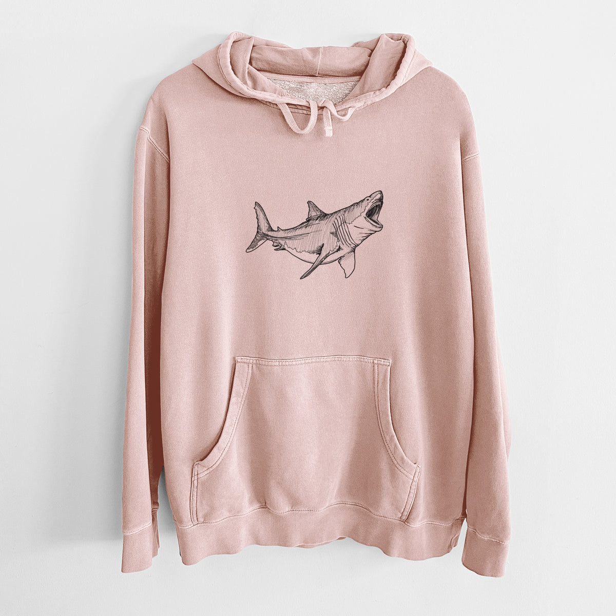 Dusty pink pigment dyed hoodie laid flat, printed with a black ink illustration of a megalodon shark with its jaws open.