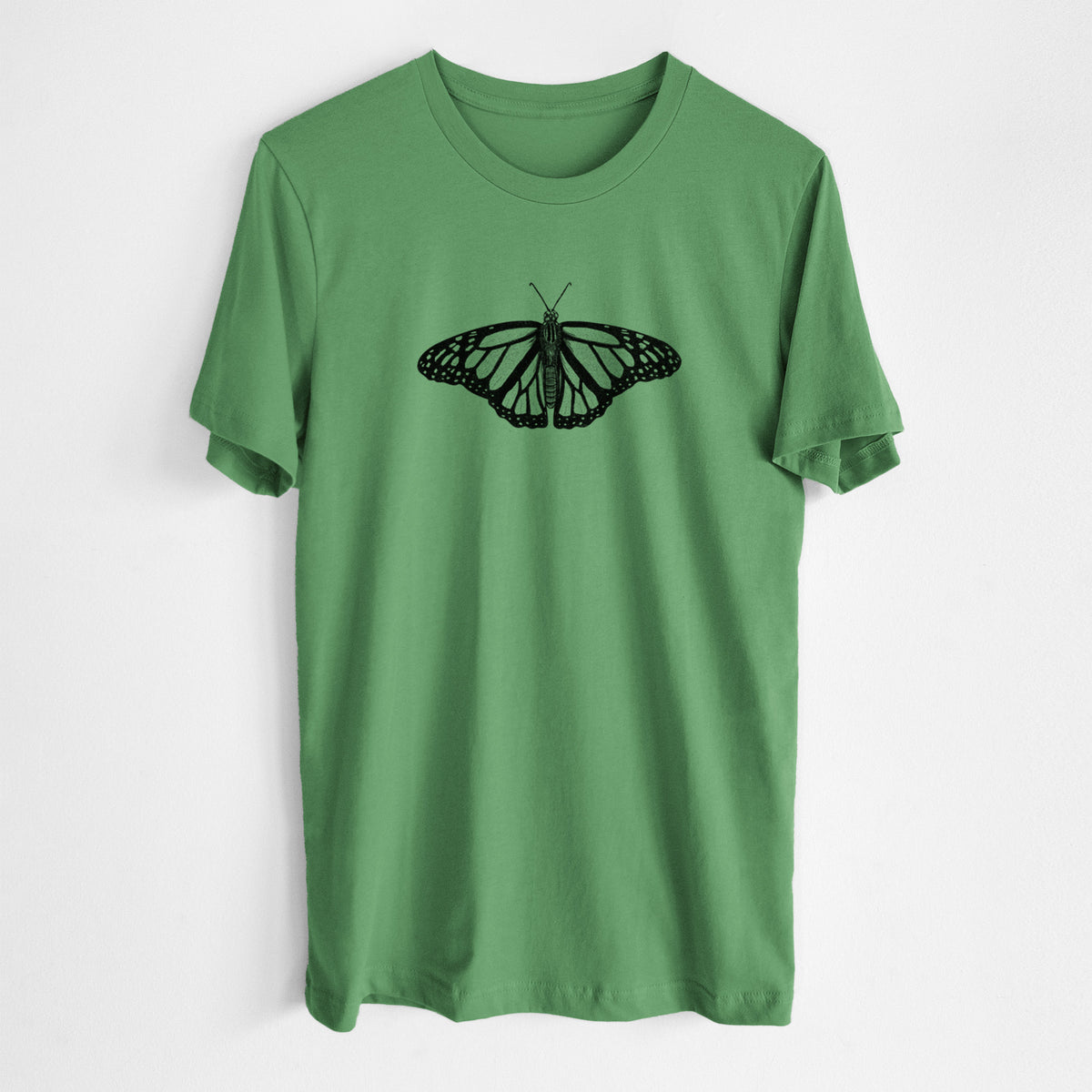 Leaf green lightweight cotton t-shirt laid flat, printed with a detailed black ink illustration of a monarch butterfly with its wings spread.