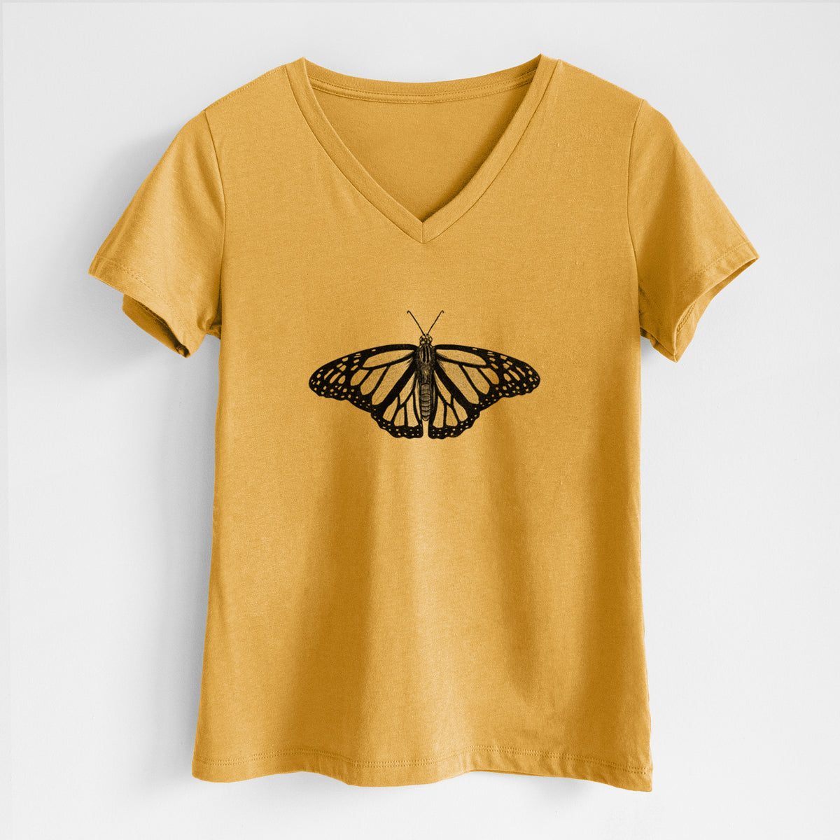 Honeycomb yellow women's relaxed fit cotton V-neck t-shirt laid flat, printed with a detailed black ink illustration of a monarch butterfly with its wings spread.